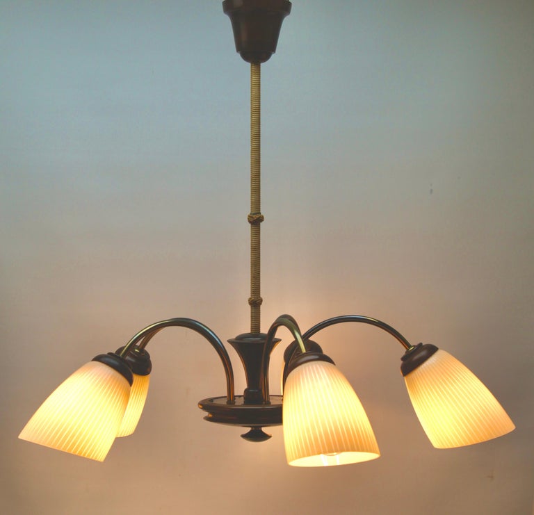 Vintage chandelier five arms Italian, 1960s

In excellent condition and in full working order. Fitting E27
Recently cleaned and polished so that it In excellent condition and in full working order.
With original patina on brass parts and
