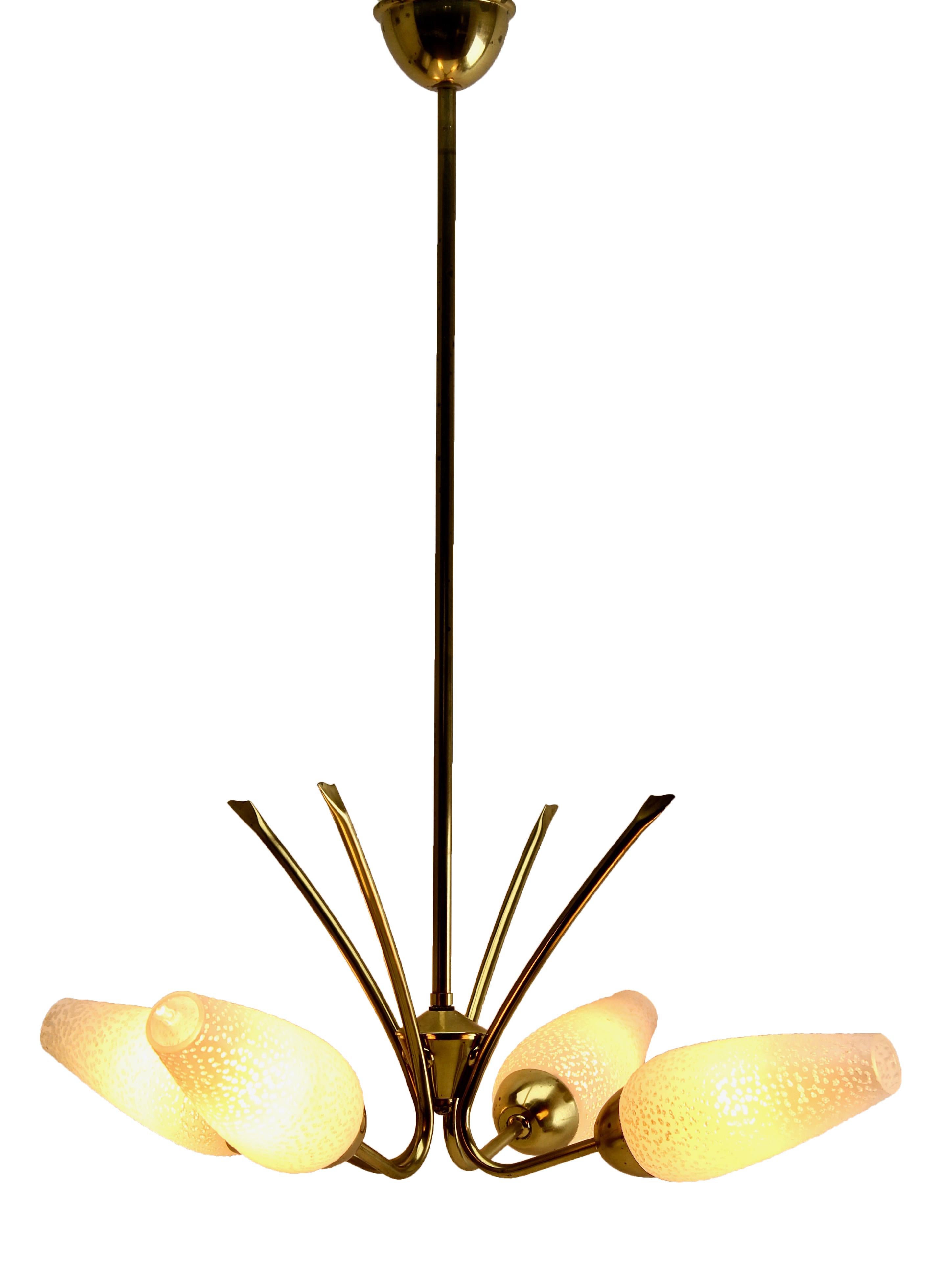 Four arms chandelier in the style of Stilnovo.

Photography fails to capture the simple elegant illumination provided by this lamp.

In excellent condition and in full working order. Fitting B22d, (Bc)
And safe for immediate usage in the USA

With