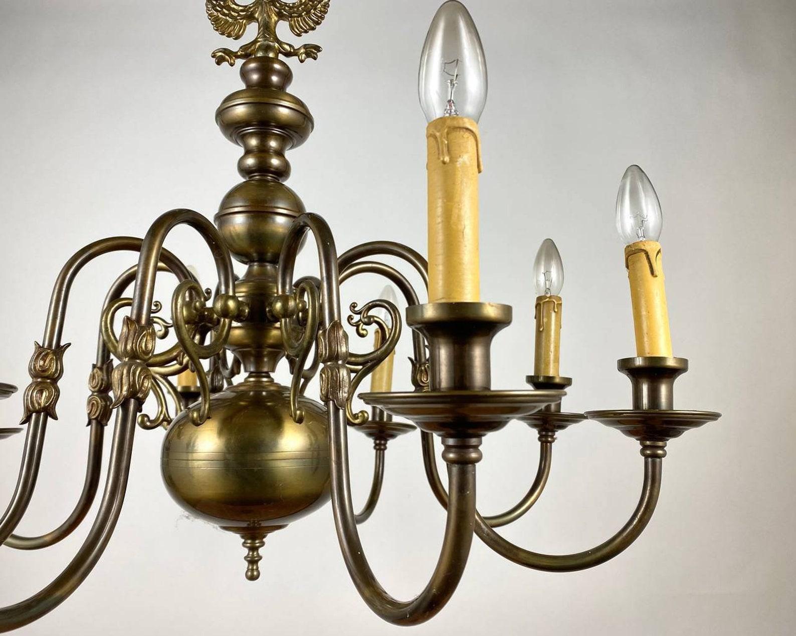 Rare vintage chandelier in the Flemish style with 8 horns, the middle of the 20th century. 

The ceiling chandelier in the classic Flemish style is made of brass. The base of the chandelier is presented in the form of a central ball bearing,