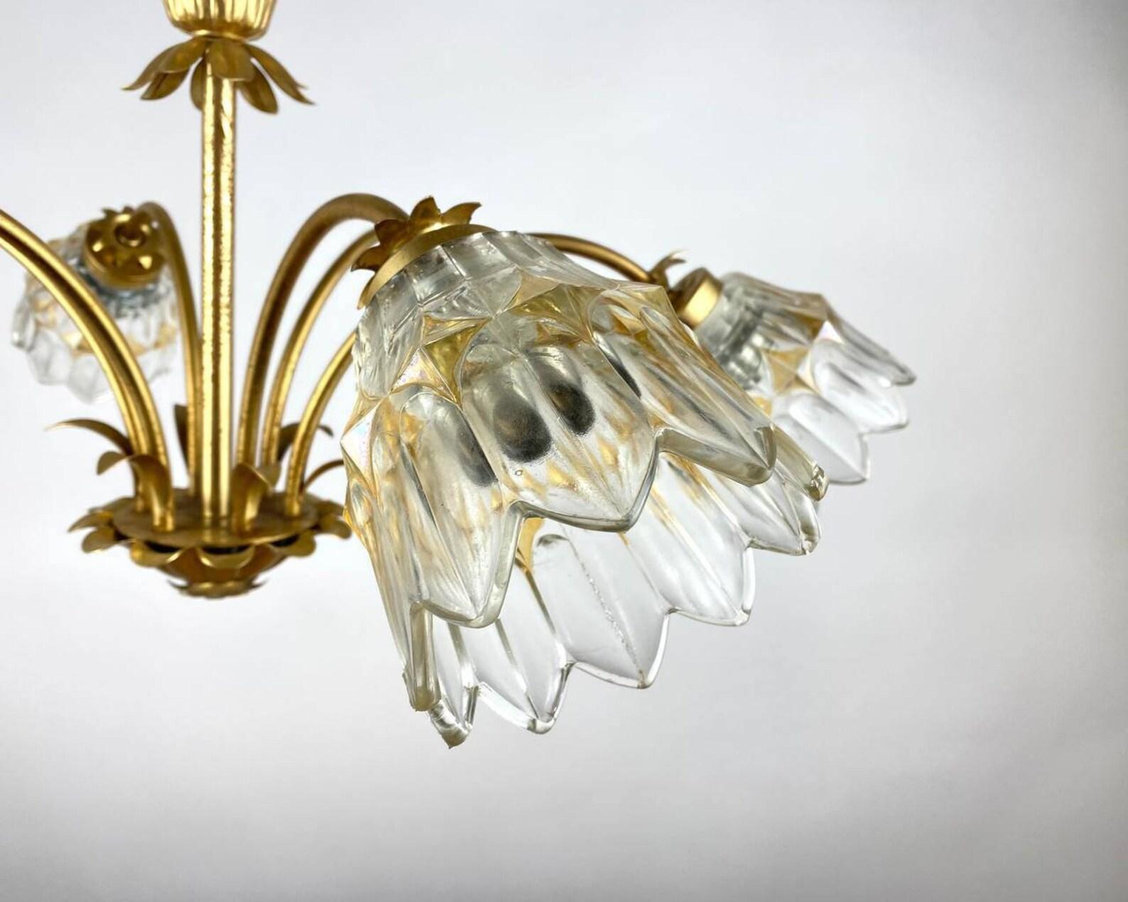 Large six-armed chandelier made of glass and gilded metal, circa 1970, Germany. 

 The device is made using materials: metal and glass. 
Exceptional metal chandelier with six transparent and gold-patterned glass cups in the shape of flowers. A