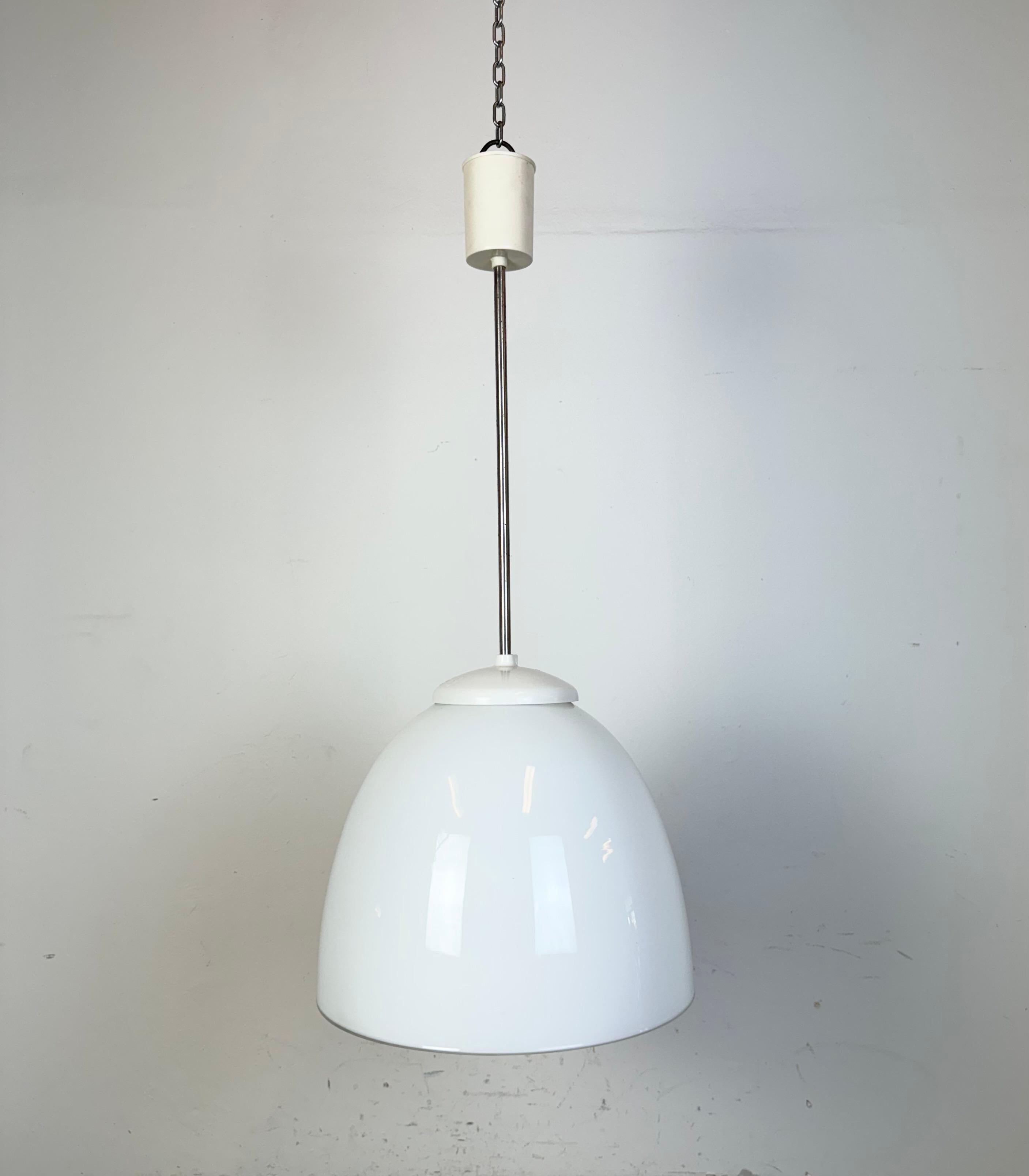 Vintage chandelier made by Elektrosvit in former Czechoslovakia during the 1960s. Made of milk glass ,chrome and bakelite. The porcelain socket requires standard E27 / E27 lightbubs. New wire. The diameter of the glass is 31 cm. Height : 63 cm.