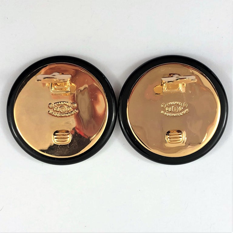Vintage Chanel 1.5 Inch Diameter Black Resin Earrings with Large Gold Tone  CCs