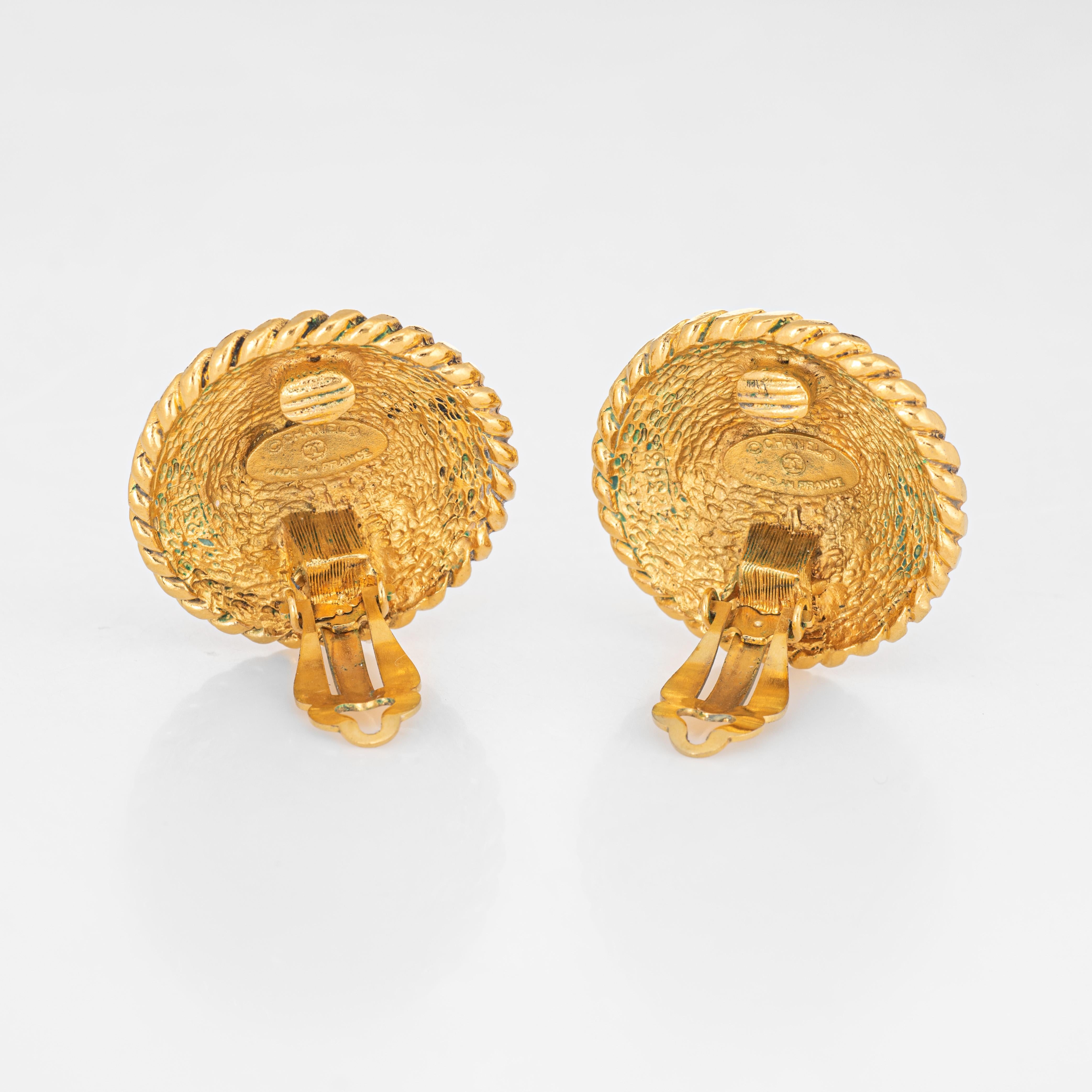 Vintage Chanel clip on earrings crafted in yellow gold tone (circa 1980s). 

The earrings feature the CC logo to the center with ornate textured detail to the outer edges. The earrings are fitted with clip on backings for non-pierced or pierced