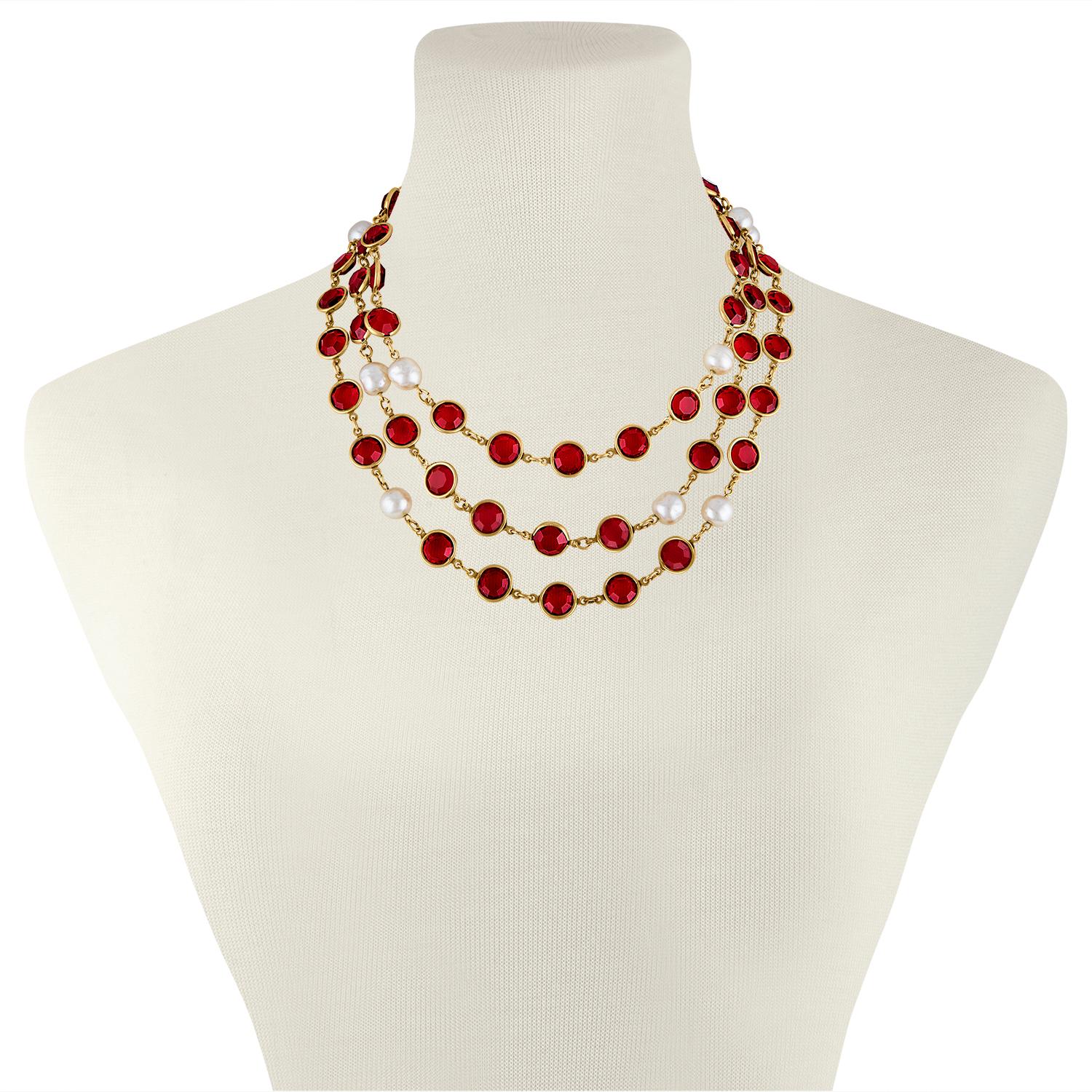 The necklace is by Chanel
The piece is from 1981.
The necklace is red Gripoix with Faux Pearls.
The necklace is 57” long.
The necklace weighs 80.9 grams