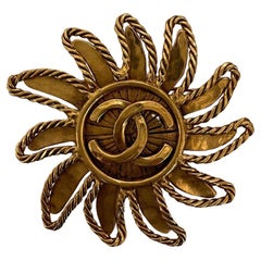 Vintage Chanel 1994 Sun Brooch Pin with Interlocking CCs