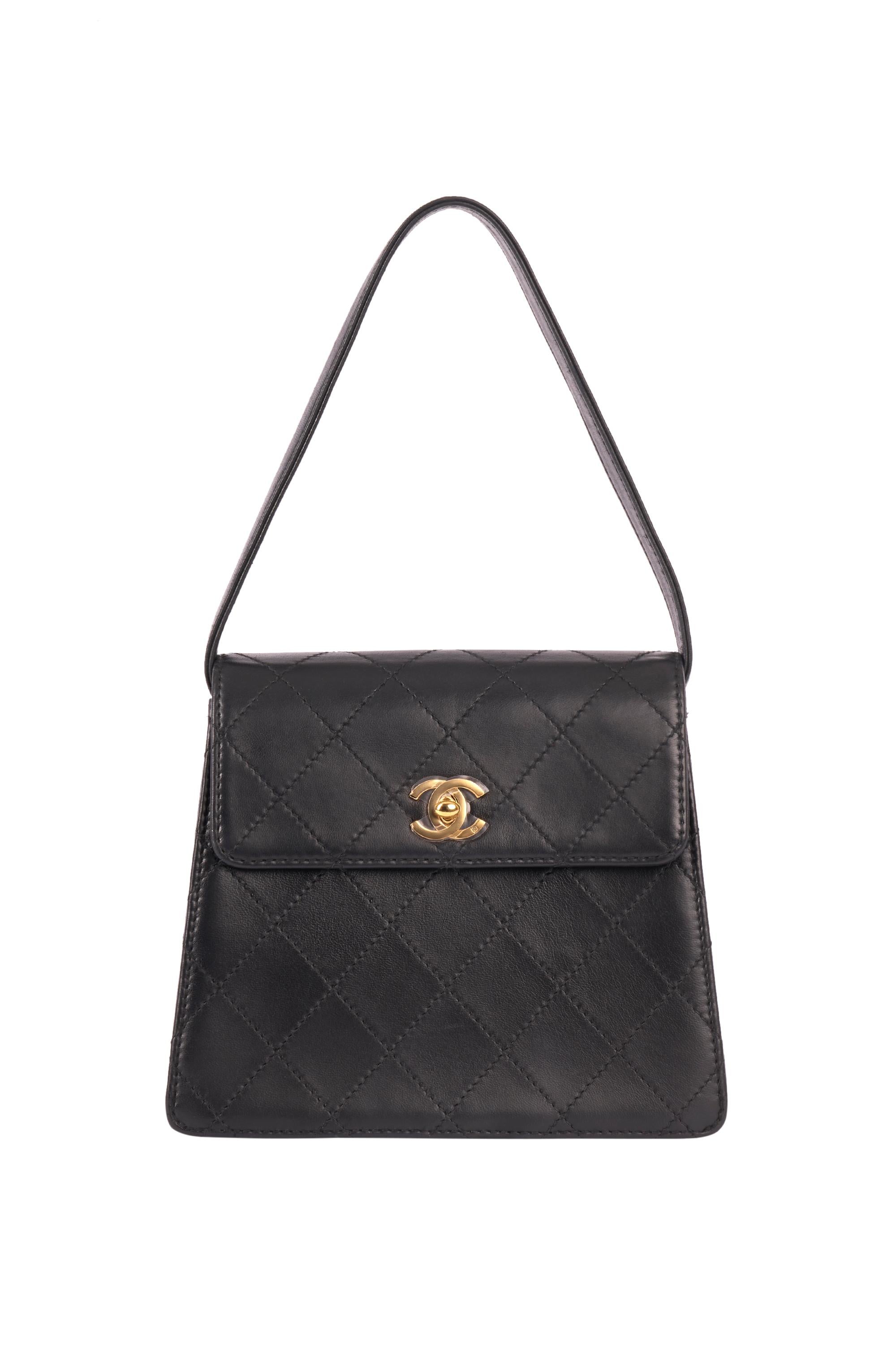 Vintage Chanel mini lambskin leather quilted box flap bag circa 1990. made of black leather quilted canvas, two internal pockets and a large one at the back . front flap leather and fastens with a gold CC logo twist lock.

Brand: Chanel
Color: