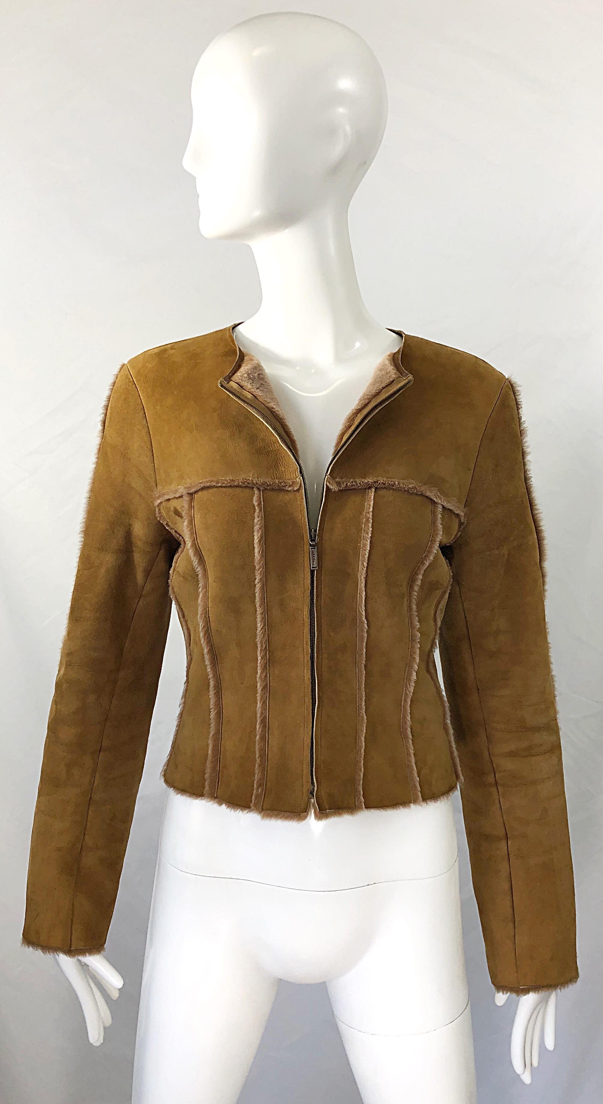 Chic vintage CHANEL Identification Fall 1999 by Karl Lagerfeld tan suede sheepskin cropped moto jacket ! The perfect color to match with anything. Fully lined with super soft plush sheepskin. Zipper up the front with Chanel embossed zipper. Fur