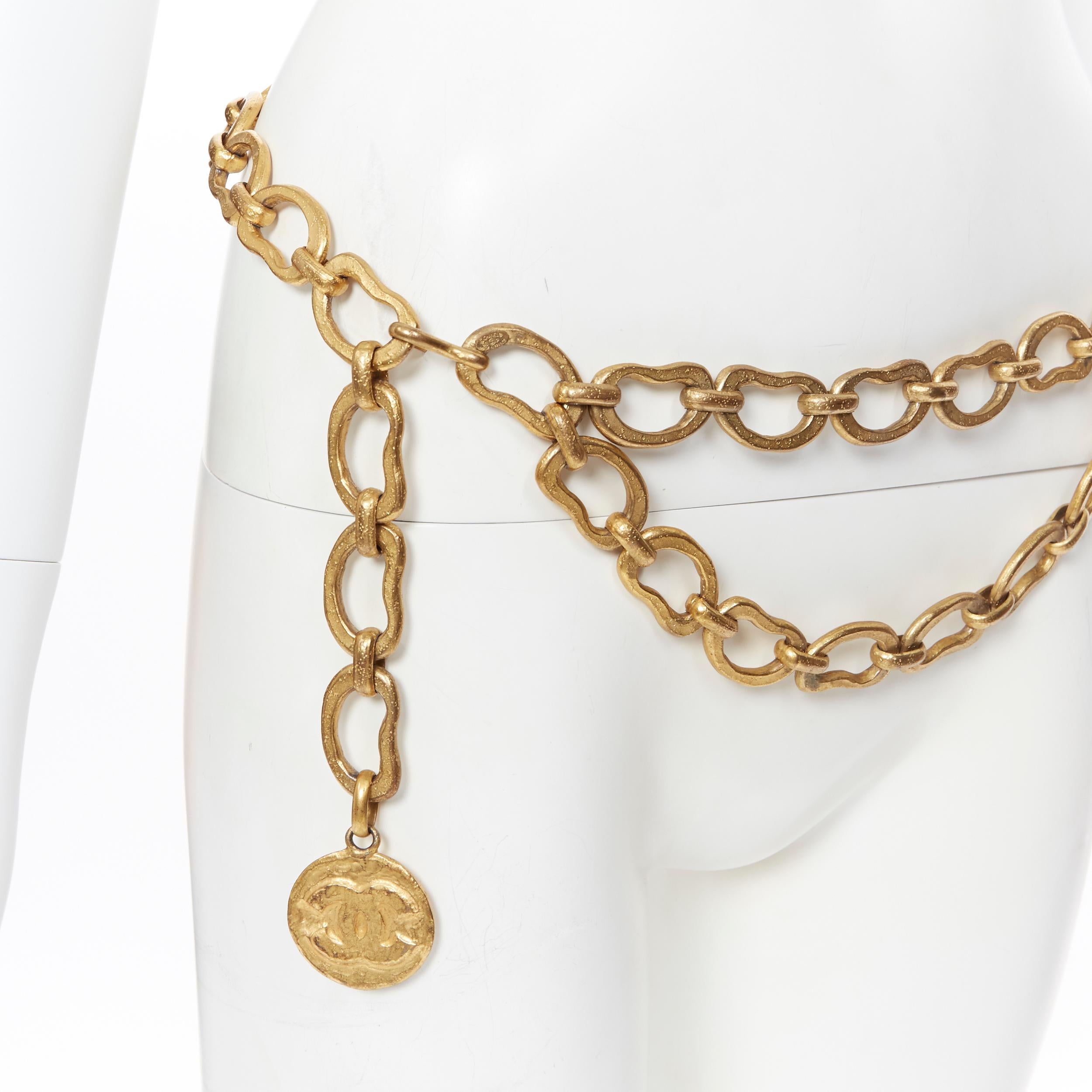 vintage CHANEL 93P antique gold tone metal looped dual chain CC medallion belt
Brand: Chanel
Designer: Karl Lagerfeld
Model Name / Style: Chain belt
Material: Metal
Color: Gold
Pattern: Solid
Closure: Hook
Made in: France

CONDITION: 
Condition: