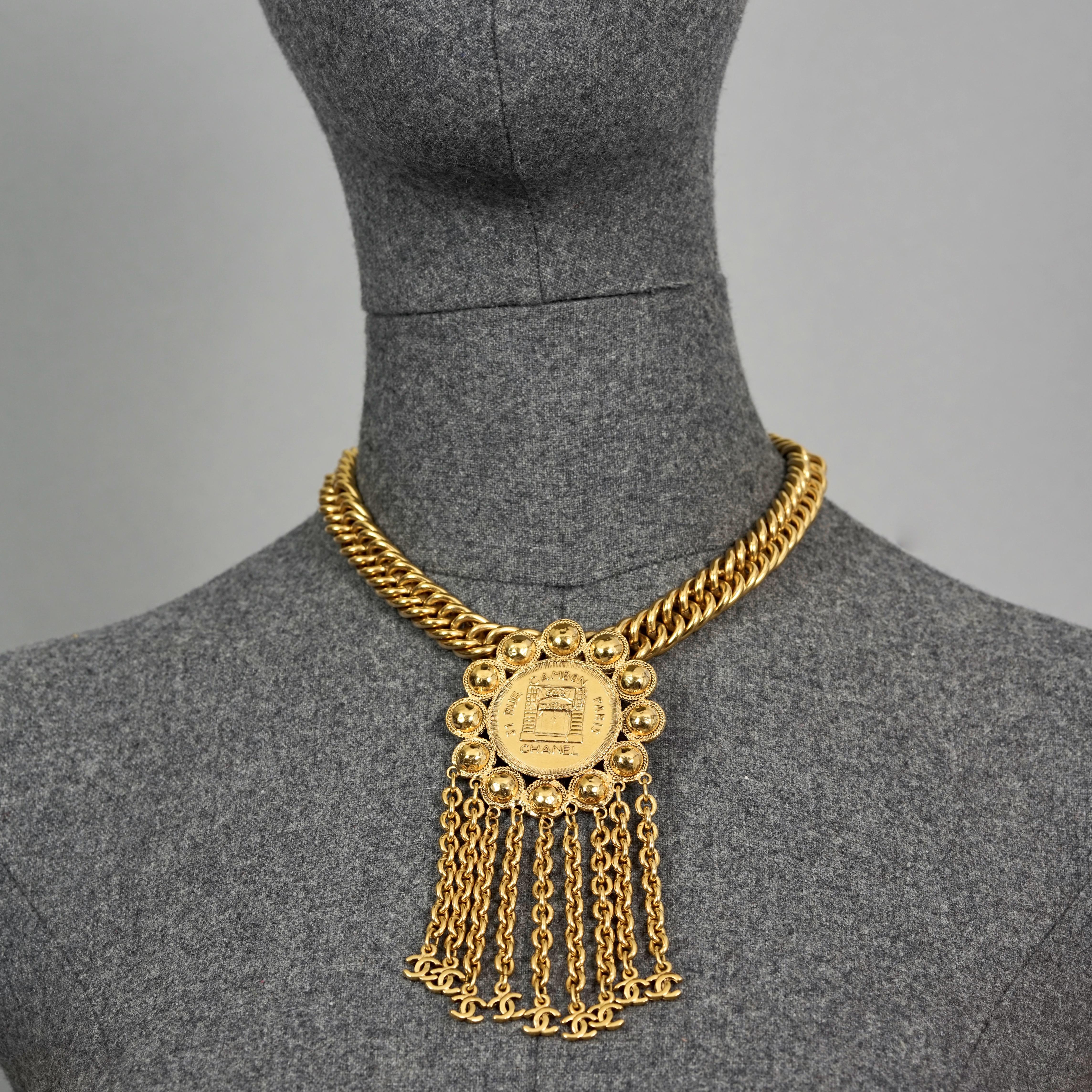 Vintage CHANEL Address Medallion Chain Fringe CC Logo Choker Necklace

Measurements:
Pendant Height: 4.40 inches (11.2 cm)
Wearable Length: 15.94 inches (40.5 cm)

Features:
- 100% Authentic CHANEL.
- Embossed Chanel front door boutique at the