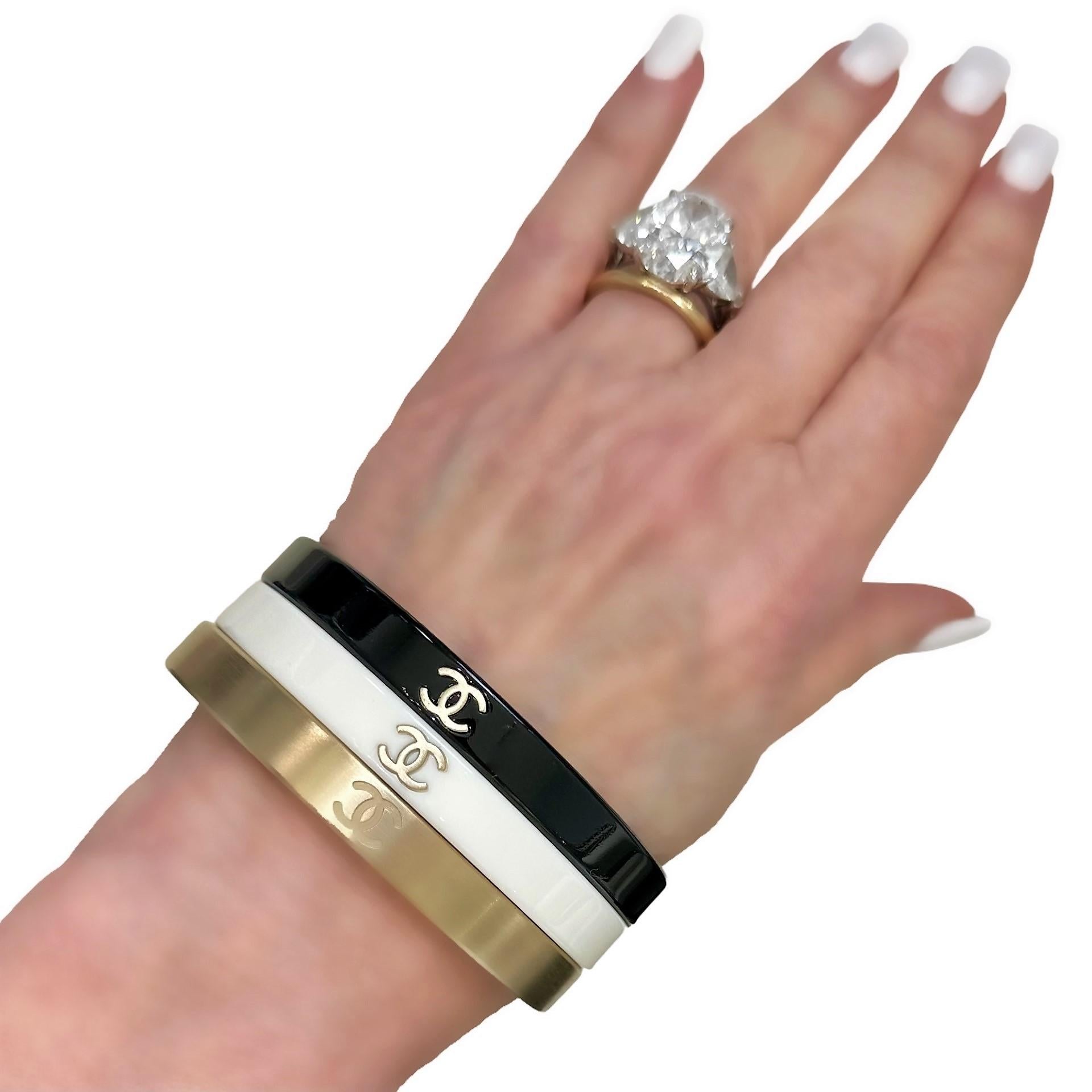 Modern Vintage Chanel Bangle Set of 3: In Gold Tone, White, & Black Resin With CC Logo 