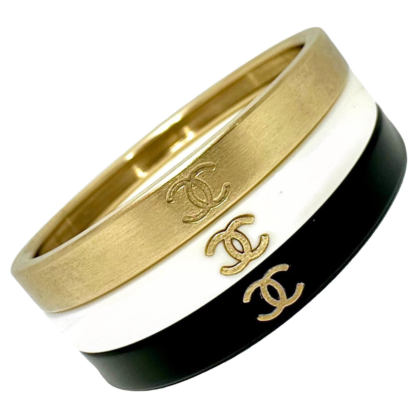 Vintage Chanel Bangle Set of 3: In Gold Tone, White, & Black Resin With CC Logo  For Sale