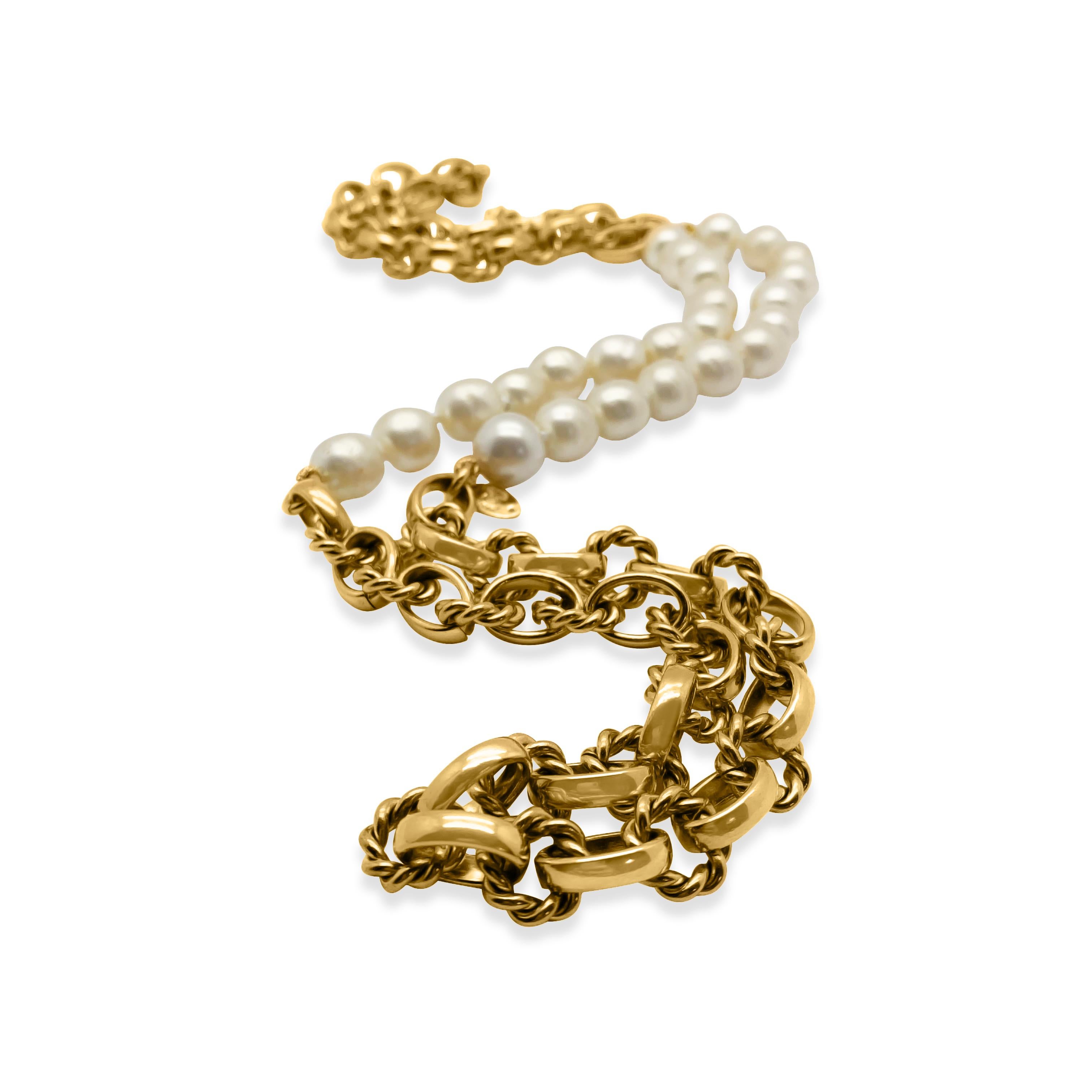 The quintessential Chanel Pearl Chain Necklace. Originating from 1983, the year Lagerfeld joined the house. Crafted in gold plated metal and glass baroque style simulated pearls. Featuring a long, elaborate chunky gold chain with twin pearl stations