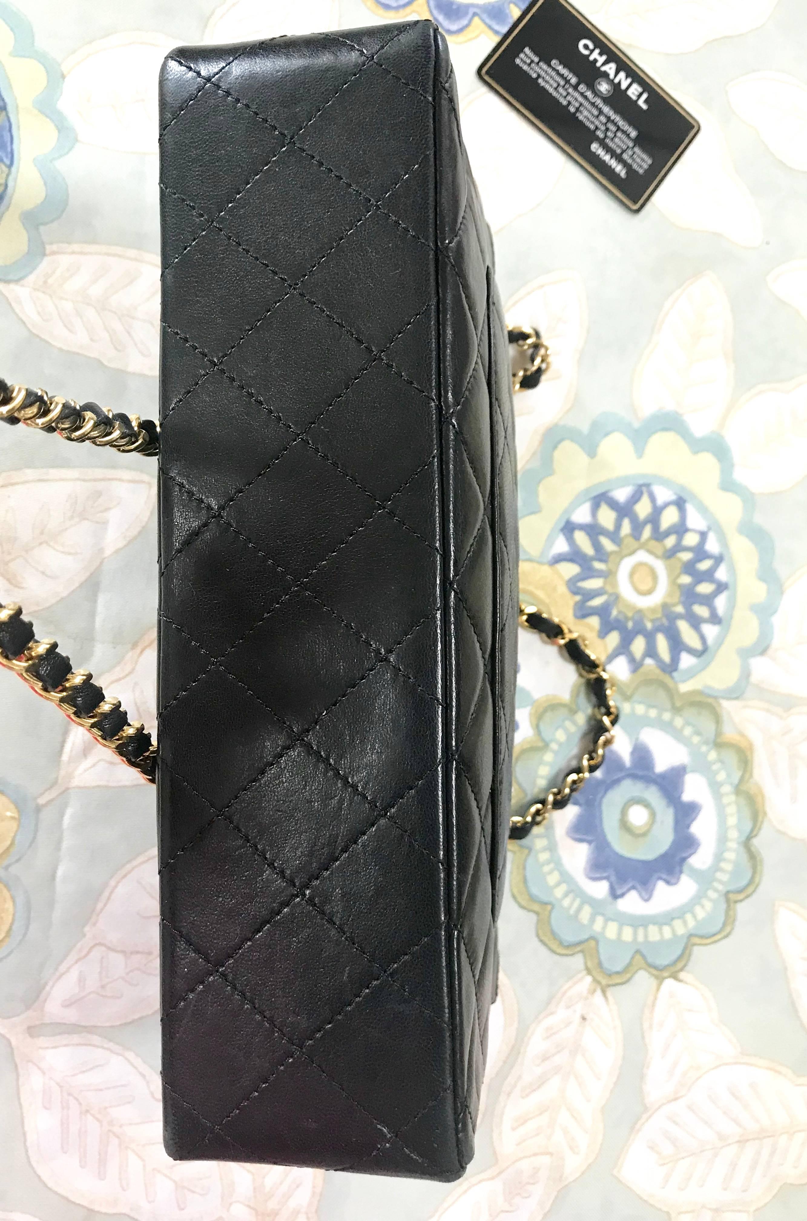 Vintage Chanel black 2.55 classic double flap bag with gold and silver CC motif. For Sale 2