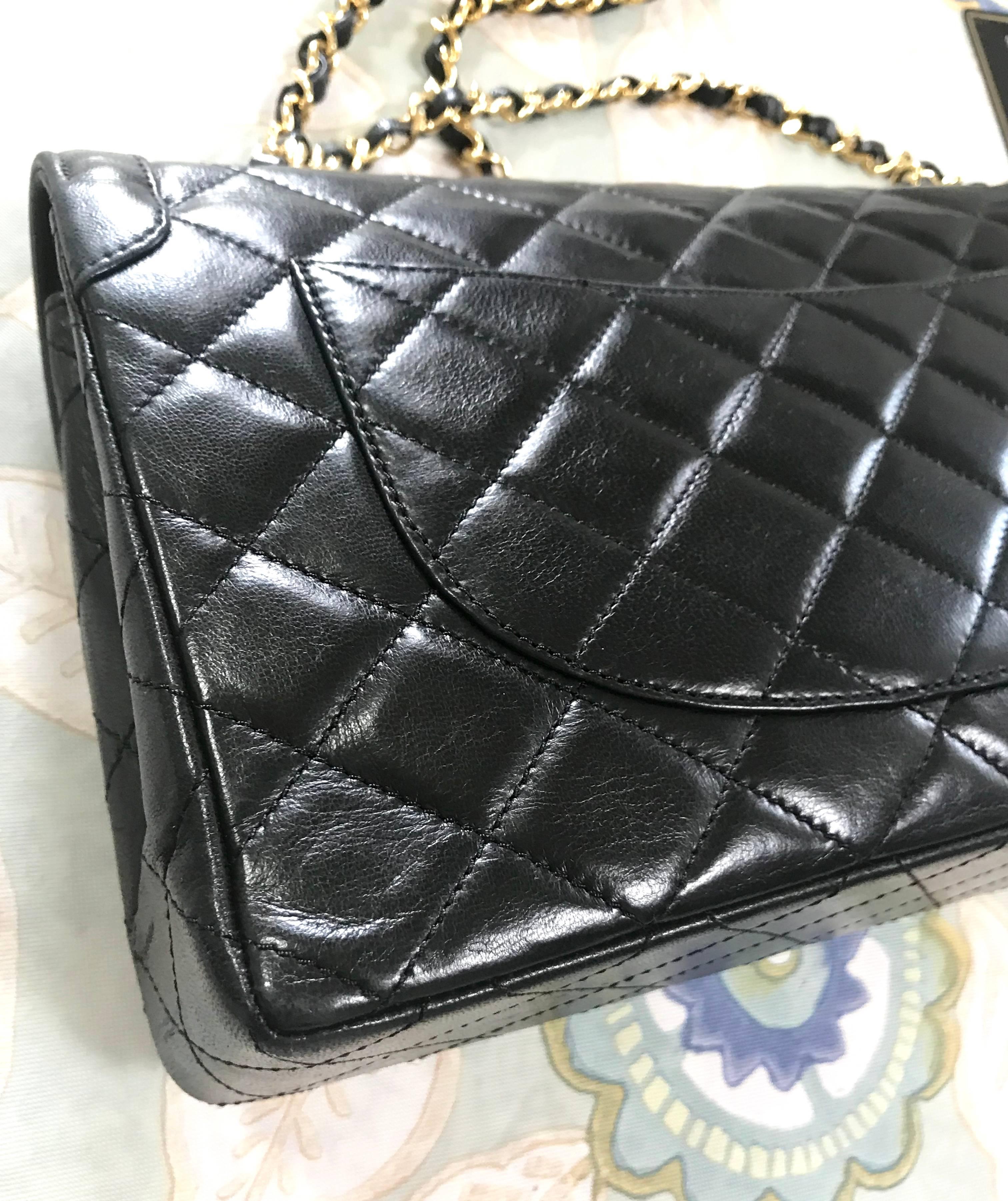 Vintage Chanel black 2.55 classic double flap bag with gold and silver CC motif. For Sale 5