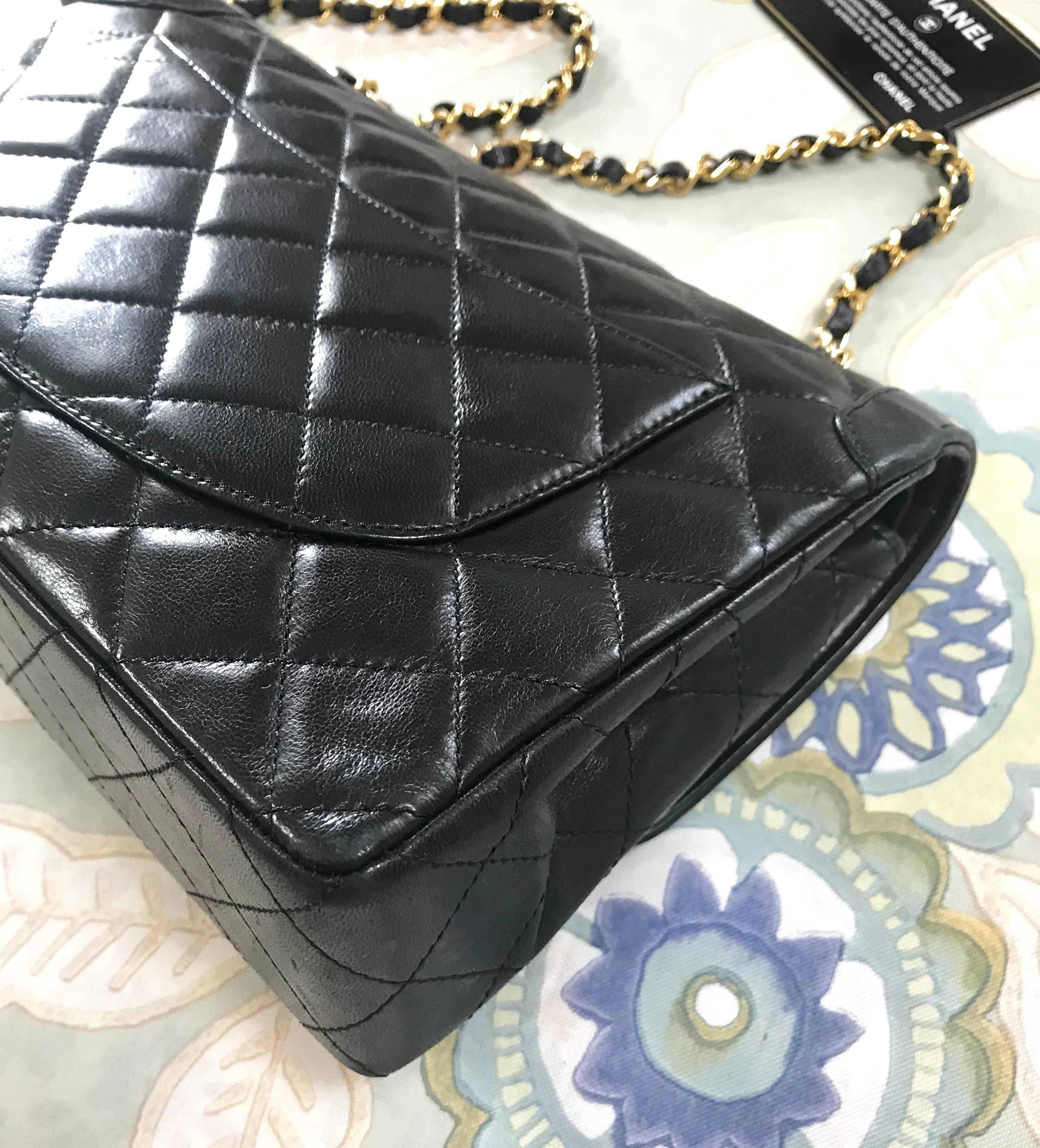 Vintage Chanel black 2.55 classic double flap bag with gold and silver CC motif. For Sale 6
