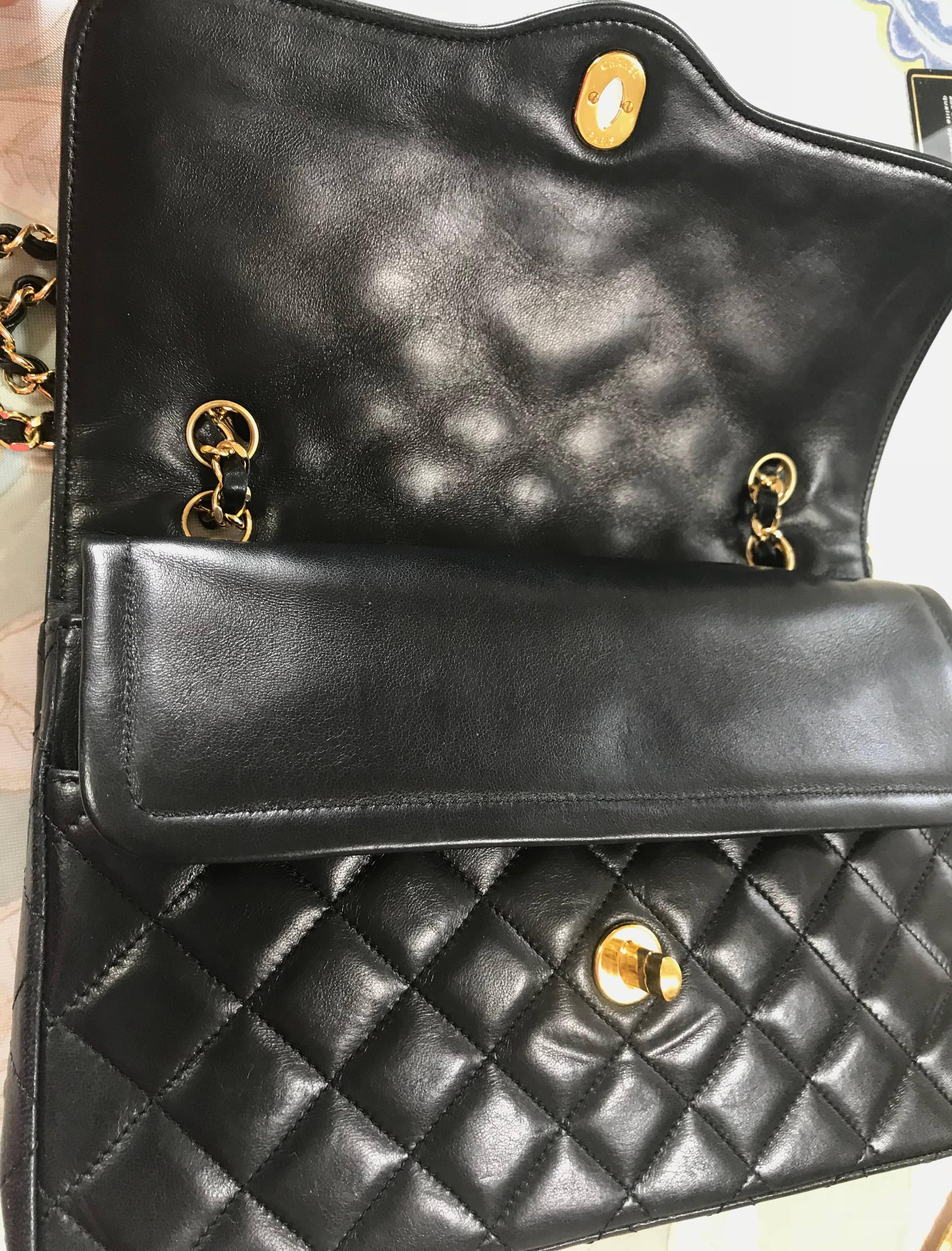 Vintage Chanel black 2.55 classic double flap bag with gold and silver CC motif. For Sale 7