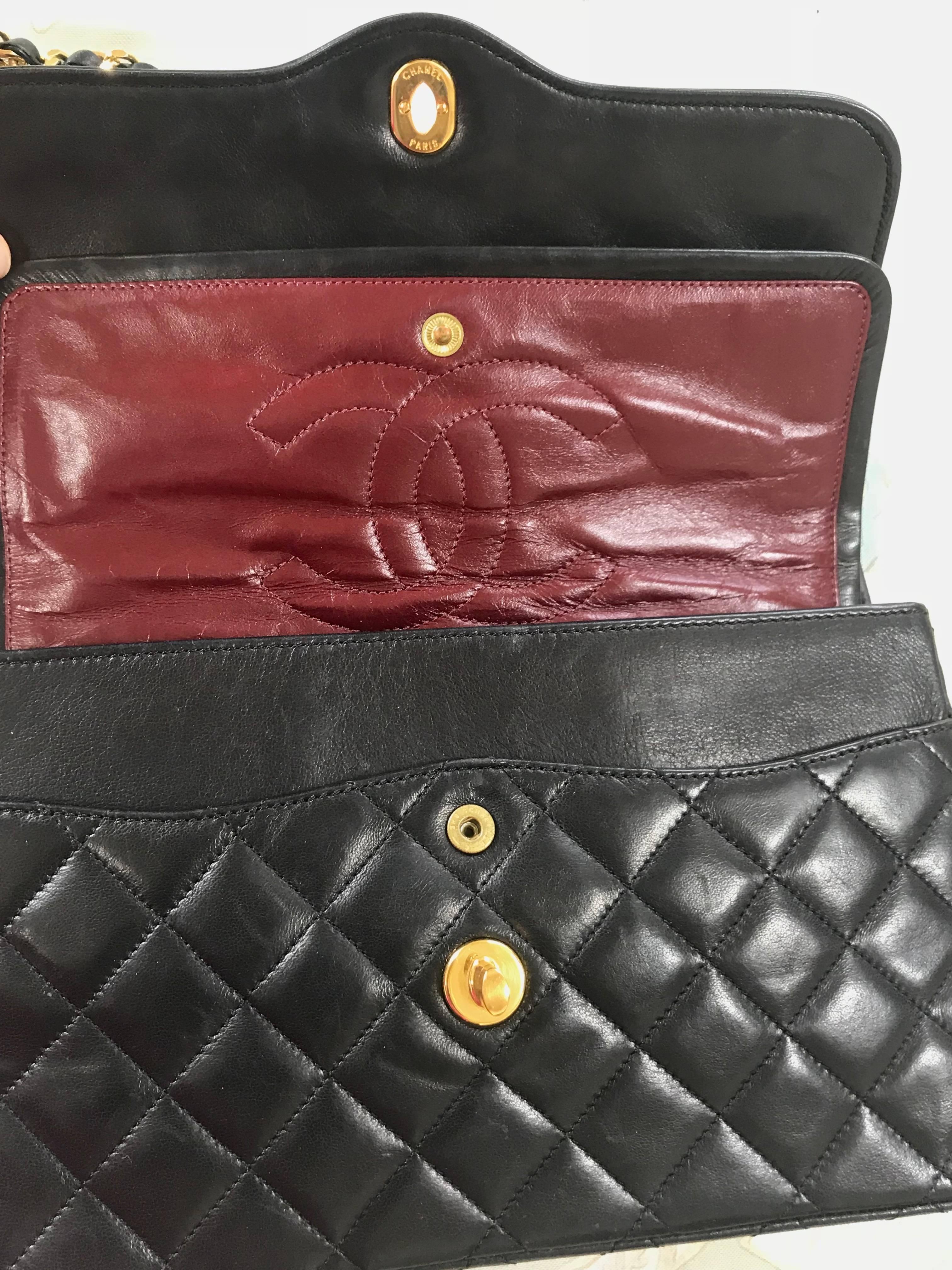 Vintage Chanel black 2.55 classic double flap bag with gold and silver CC motif. For Sale 8