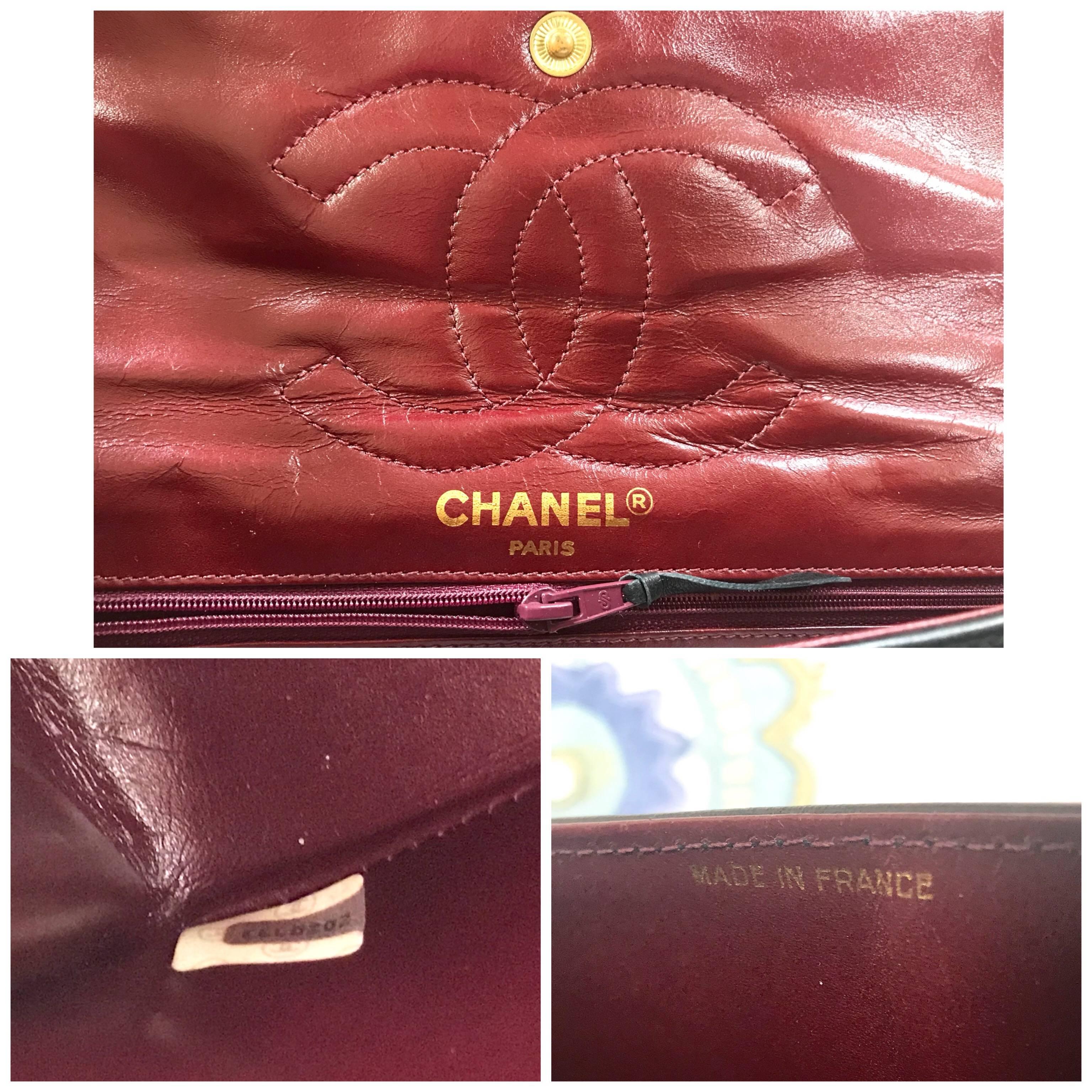 Vintage Chanel black 2.55 classic double flap bag with gold and silver CC motif. For Sale 10