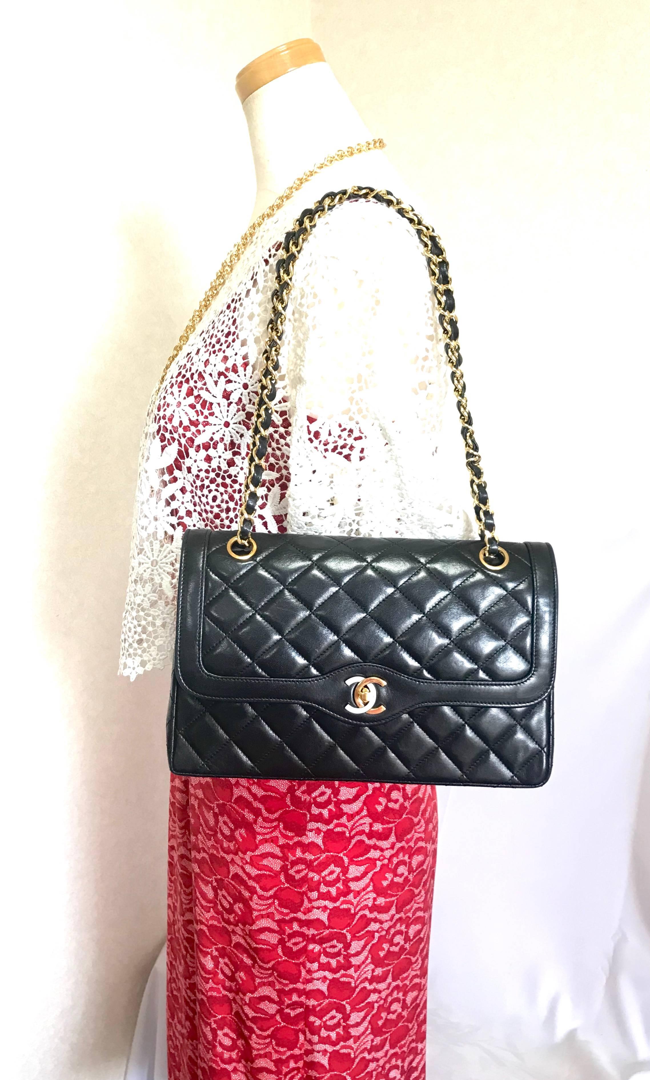 Vintage Chanel black 2.55 classic double flap bag with gold and silver CC motif. For Sale 11