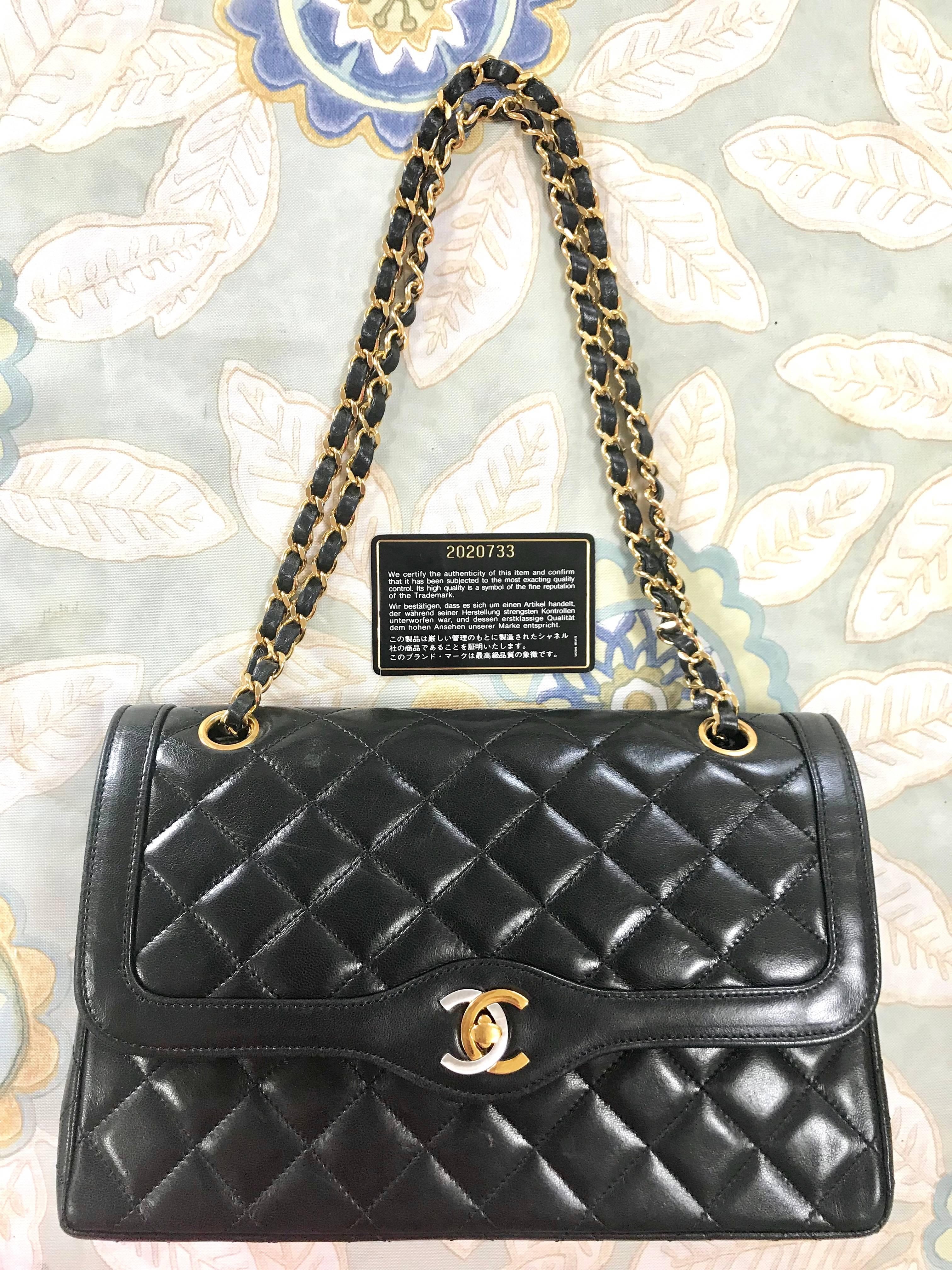 1990s. Vintage Chanel black 2.55 classic double flap bag with gold and silver CC motif and chains. Paris limited edition. Beautiful condition.

Beautiful condition!

Introducing a rare vintage CHANEL black lambskin classic 2.55 double flap purse