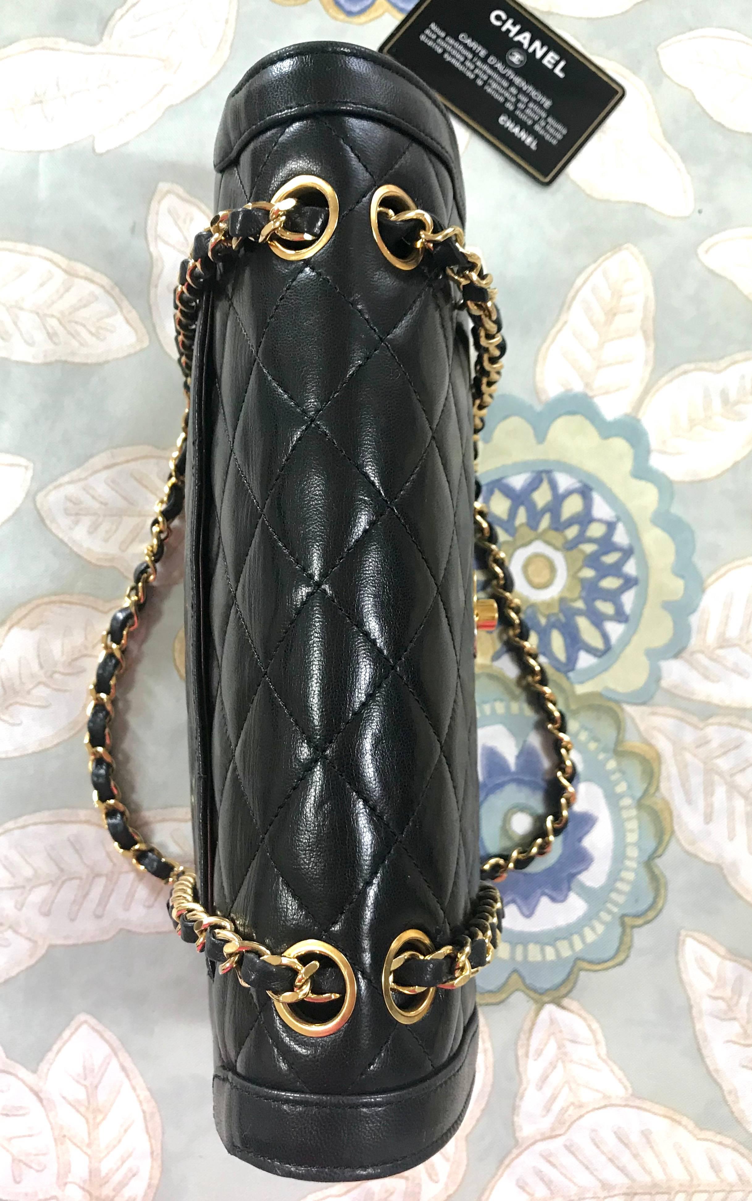 Vintage Chanel black 2.55 classic double flap bag with gold and silver CC motif. For Sale 1