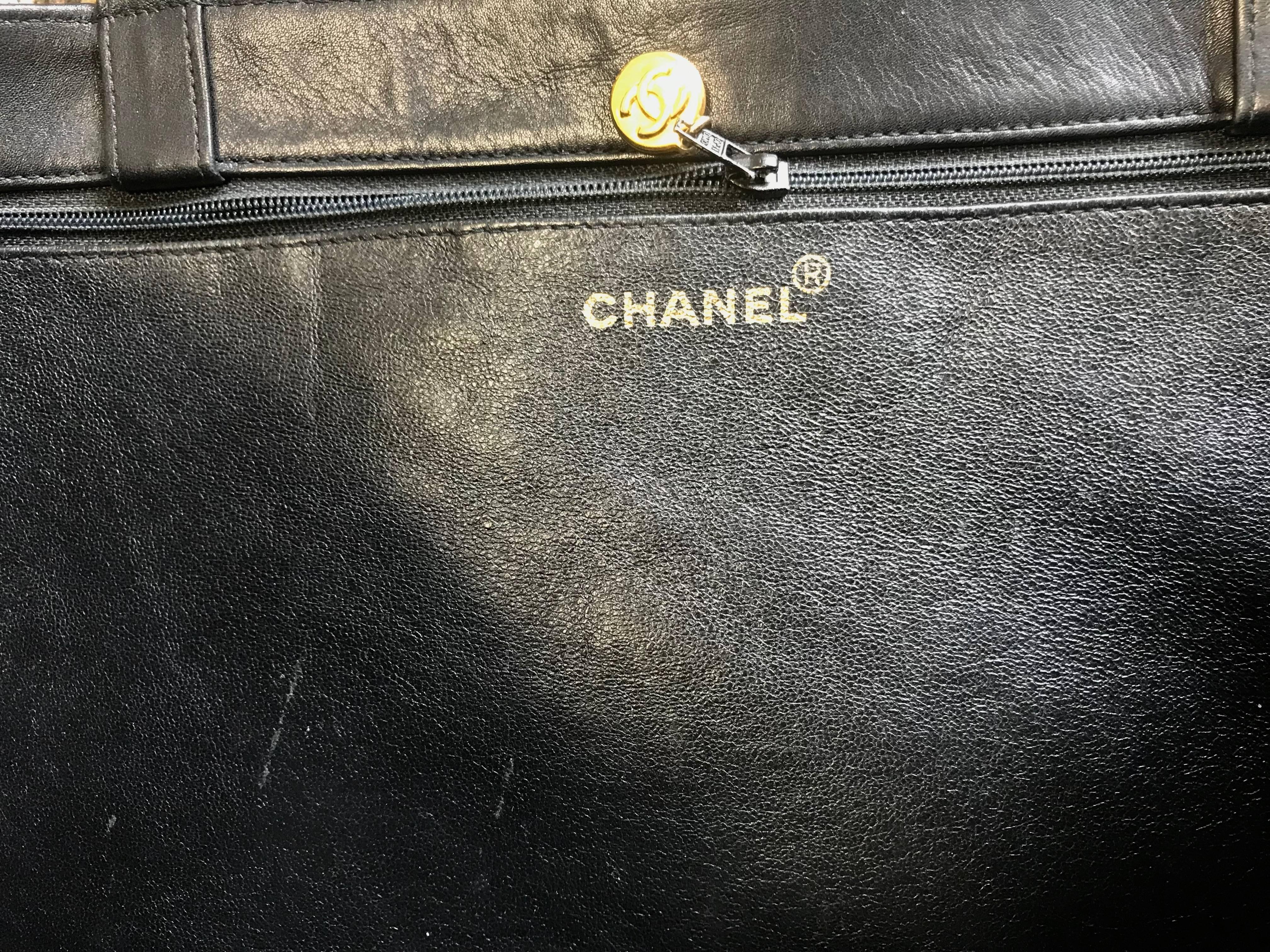 Chanel Vintage black calfskin large tote bag with gold tone chain handles and CC 8