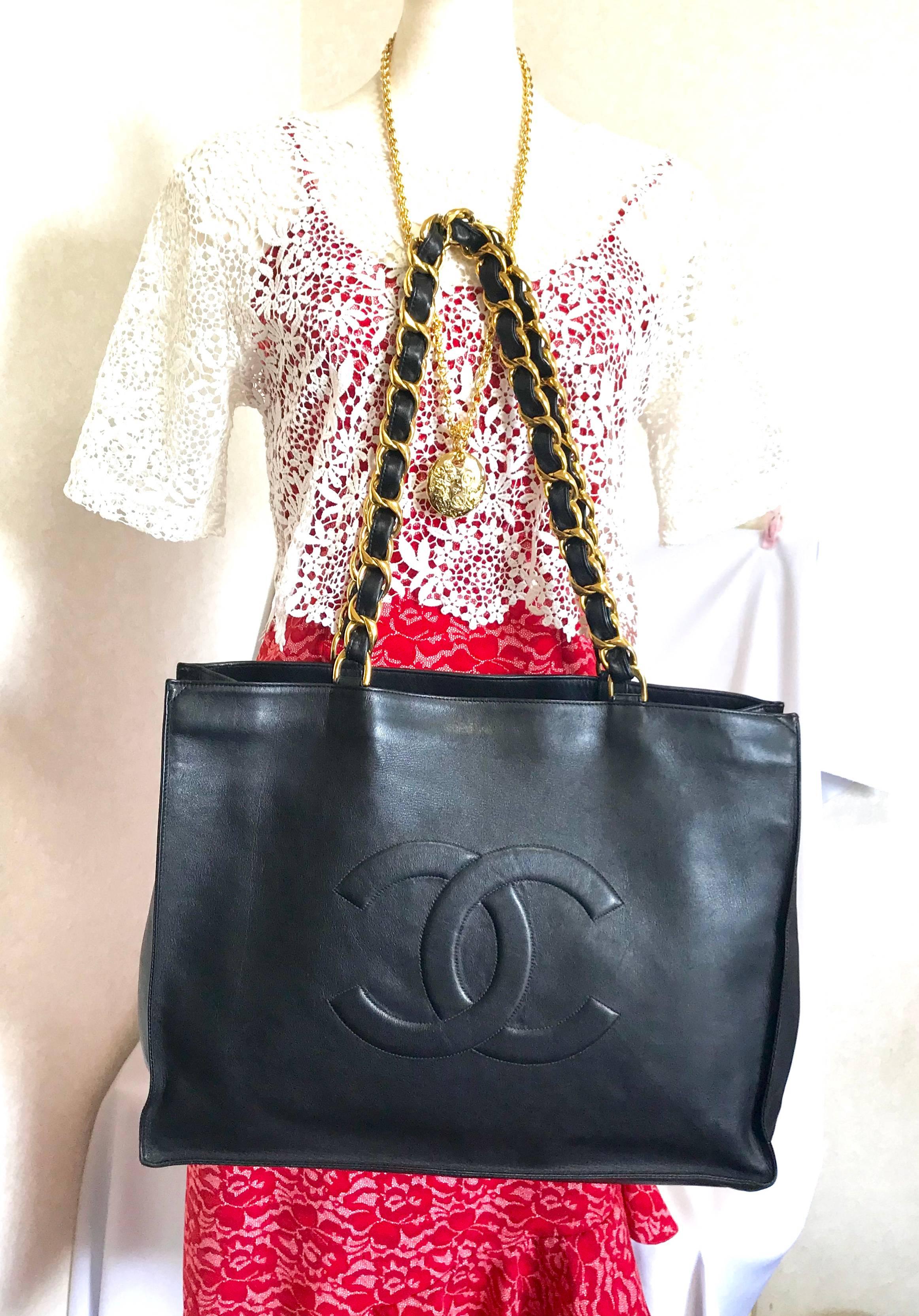 Chanel Vintage black calfskin large tote bag with gold tone chain handles and CC 12