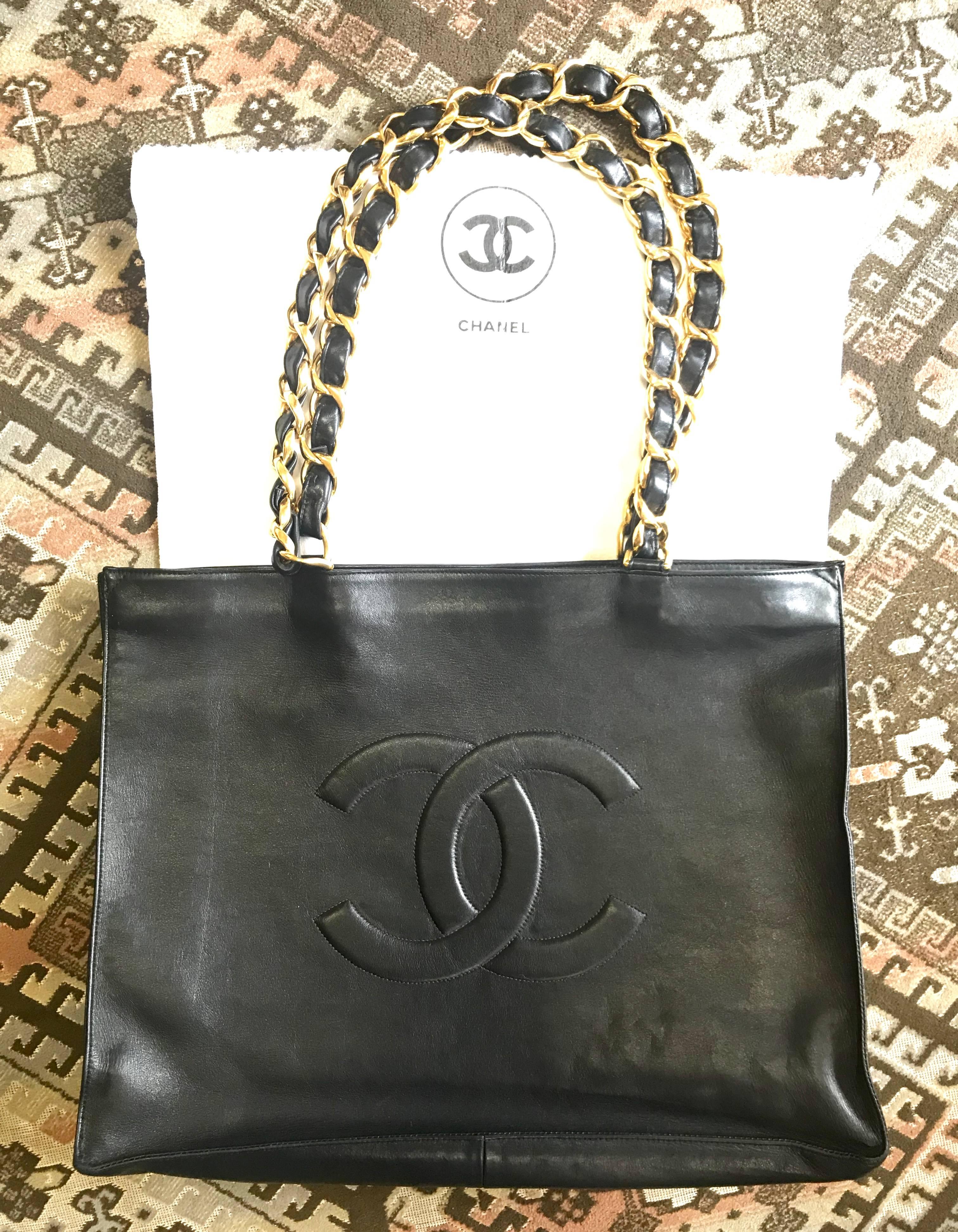 Chanel Vintage black calfskin large tote bag with gold tone chain handles and CC 13