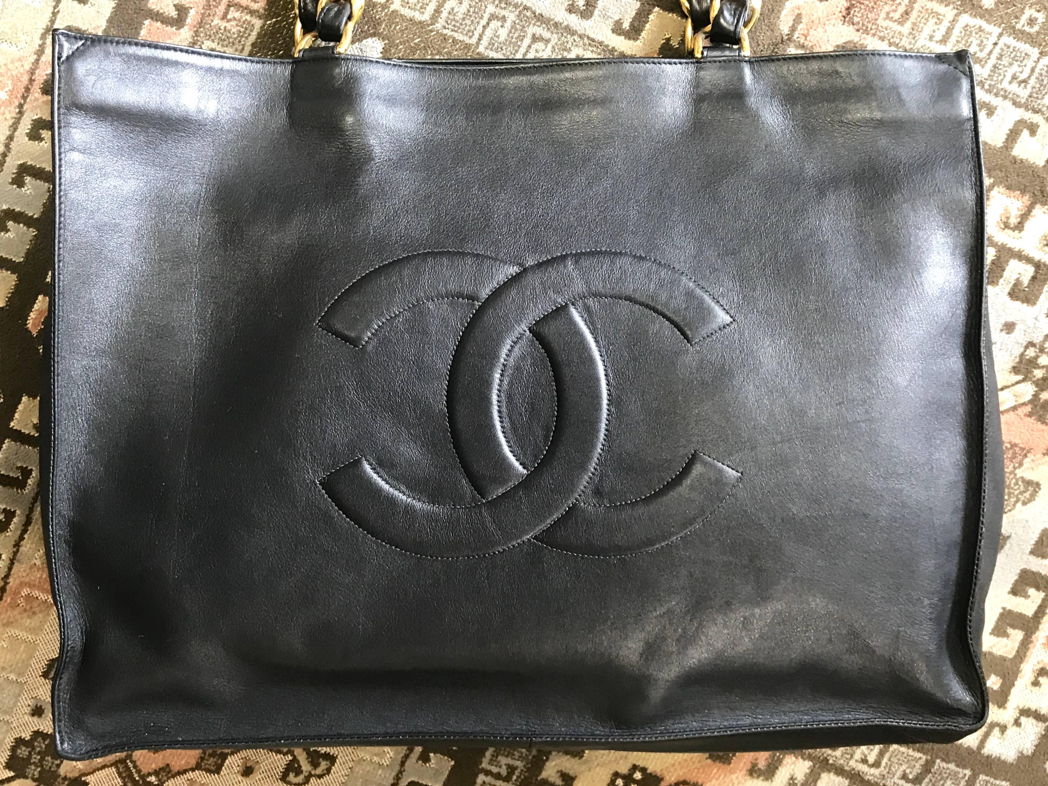 Gray Chanel Vintage black calfskin large tote bag with gold tone chain handles and CC