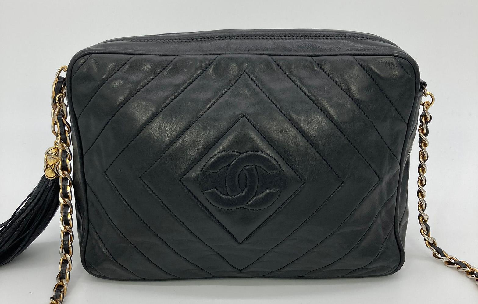 Vintage Chanel Black Diamond Quilted Tassel Camera Bag in good condition. Black diamond quilted lambskin exterior leather with CC logo quilted in center of diamond on front side. Gold hardware and woven chain and leather shoulder strap. Black fringe