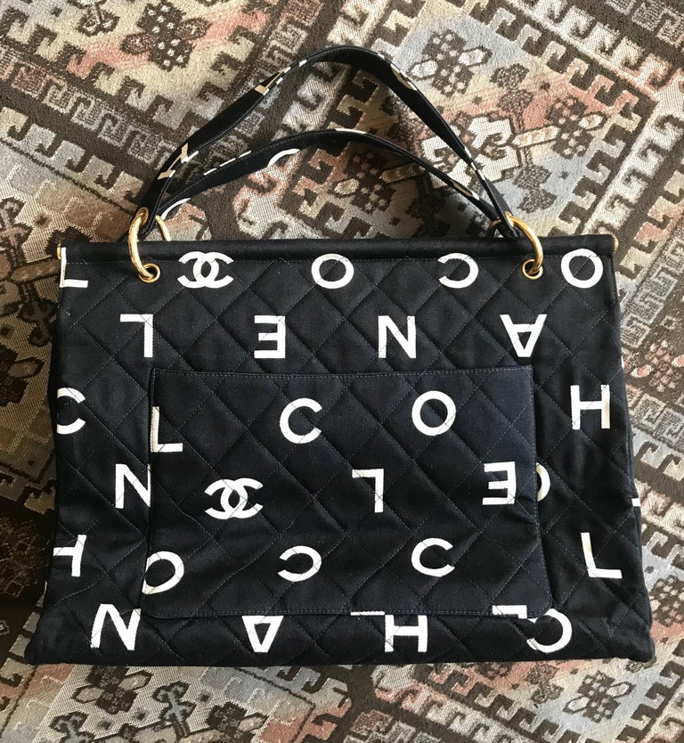 Vintage CHANEL black fabric canvas large tote bag with white Chanel CC  prints. For Sale at 1stDibs