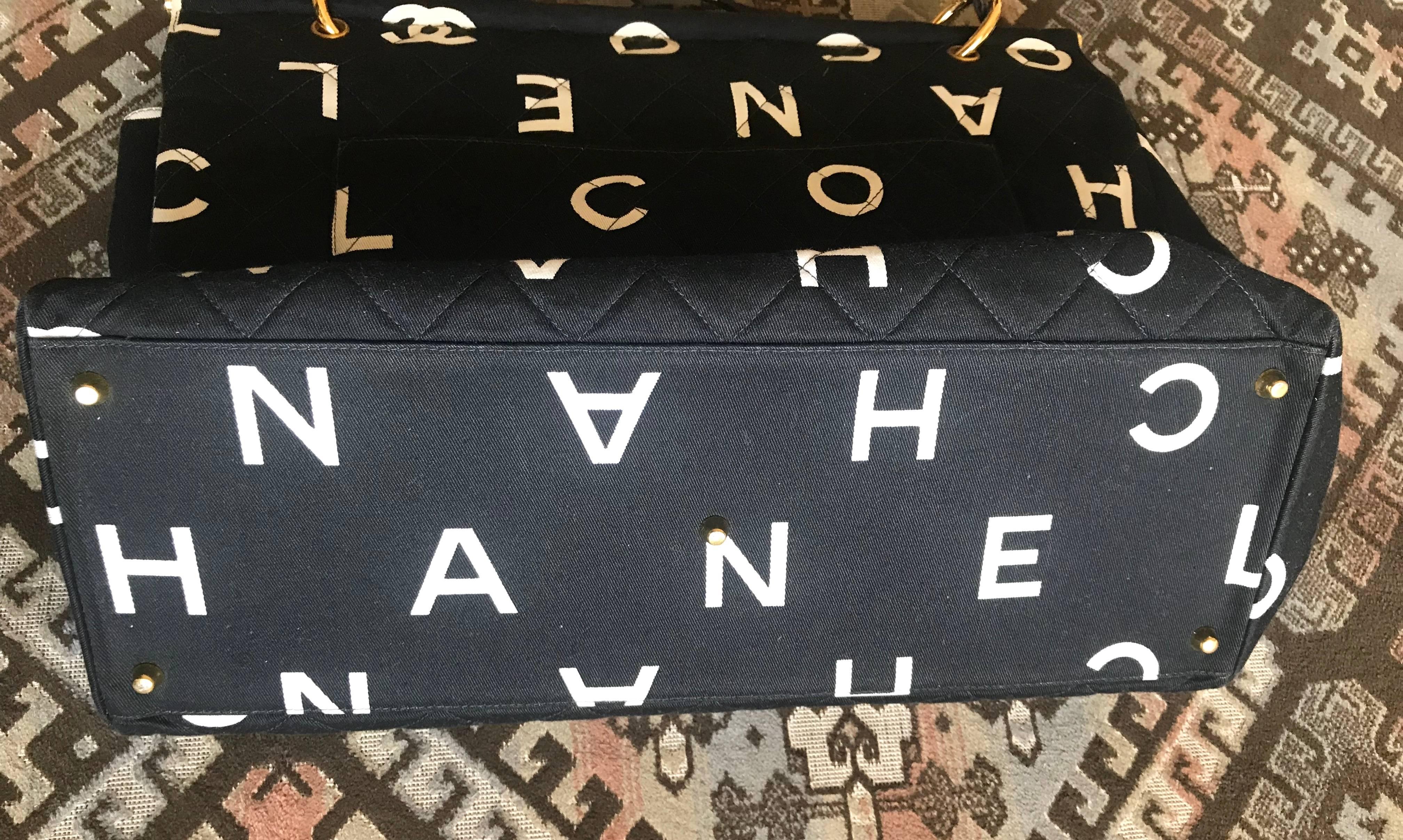 Black Vintage CHANEL black fabric canvas large tote bag with white Chanel CC prints. For Sale