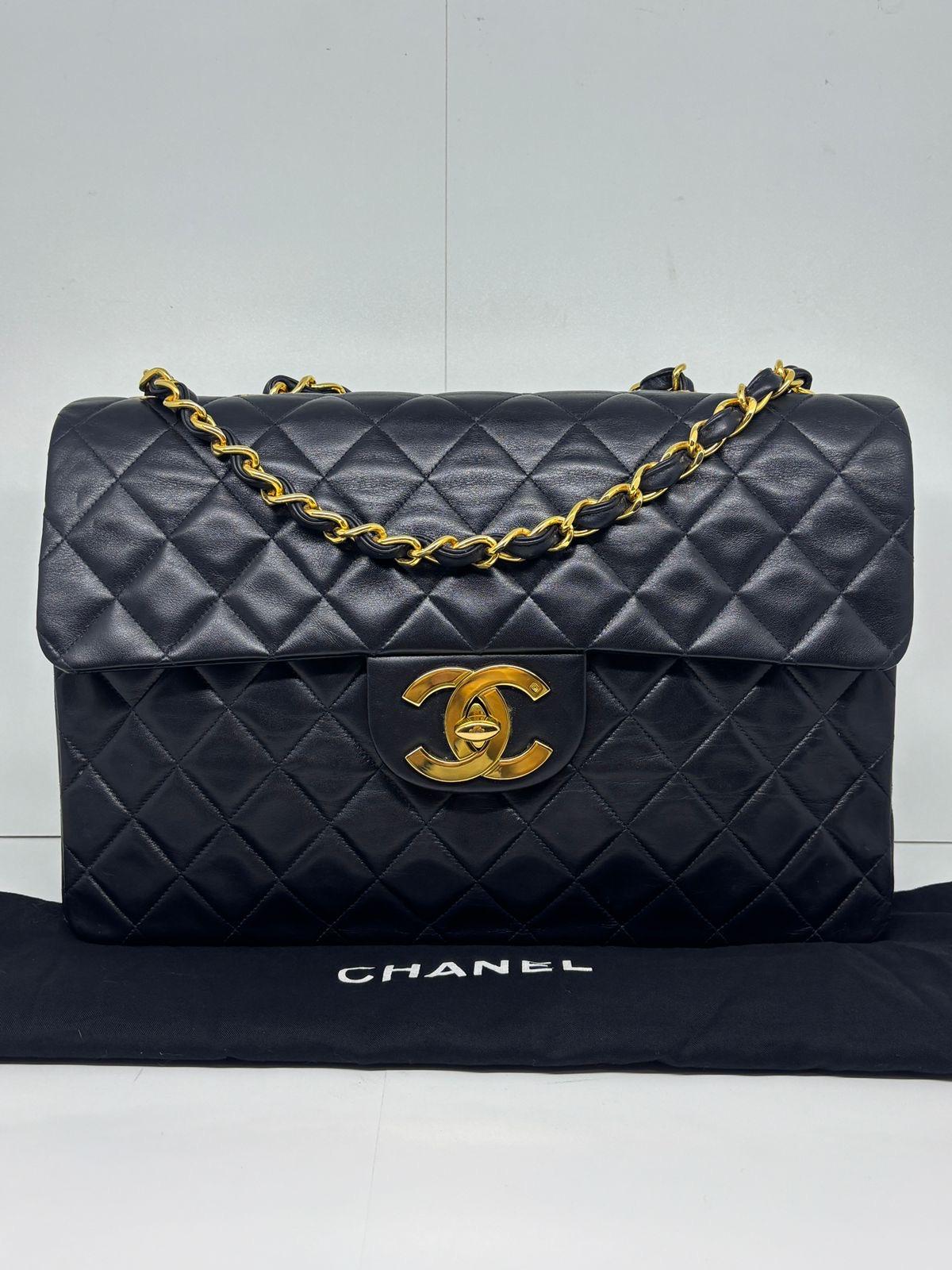 Vintage chanel maxi in black lambskin with big CC turn lock in 24k gold plated hardware. Beautiful glossy vintage condition. Original condition. Minor scuffs and scratches on the leather and corners. Series #3 with the holo still intact although a