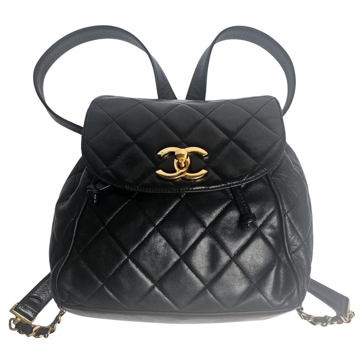Beautiful vintage Chanel backpack in black lambskin with gold hardware details. Slight scuffing and loss to the lambskin leather, but overall in good vintage condition. Light tarnishing on the hardware details. Hologram still intact but has rubbed