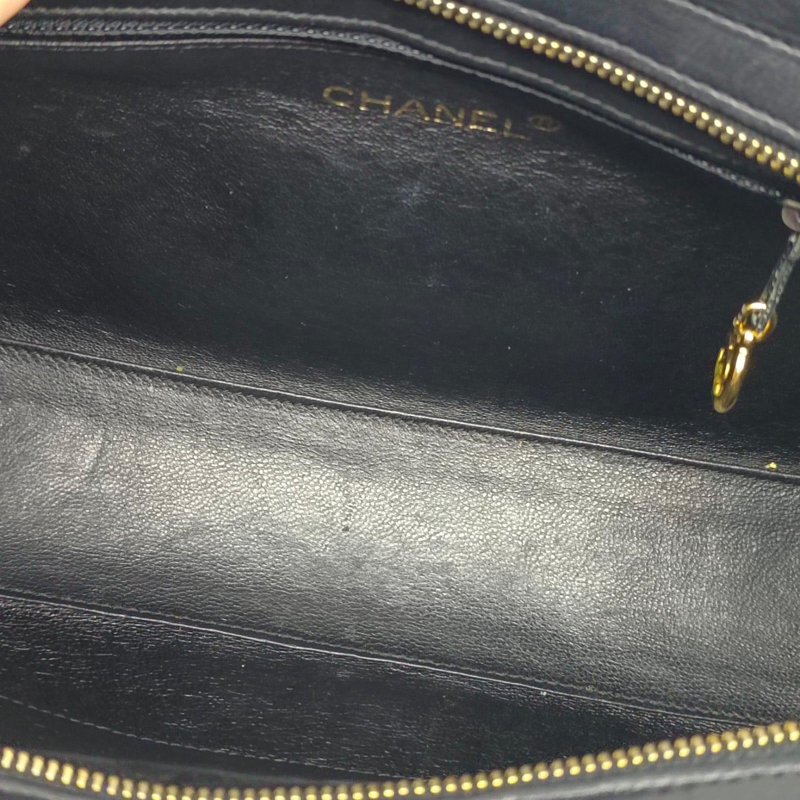 Vintage chanel black mini tote. Overall in good vintage condition with minor scuffing on the leather area. Comes with its holo, card and replacement dust bag (with entrupy cert). Series #5. 