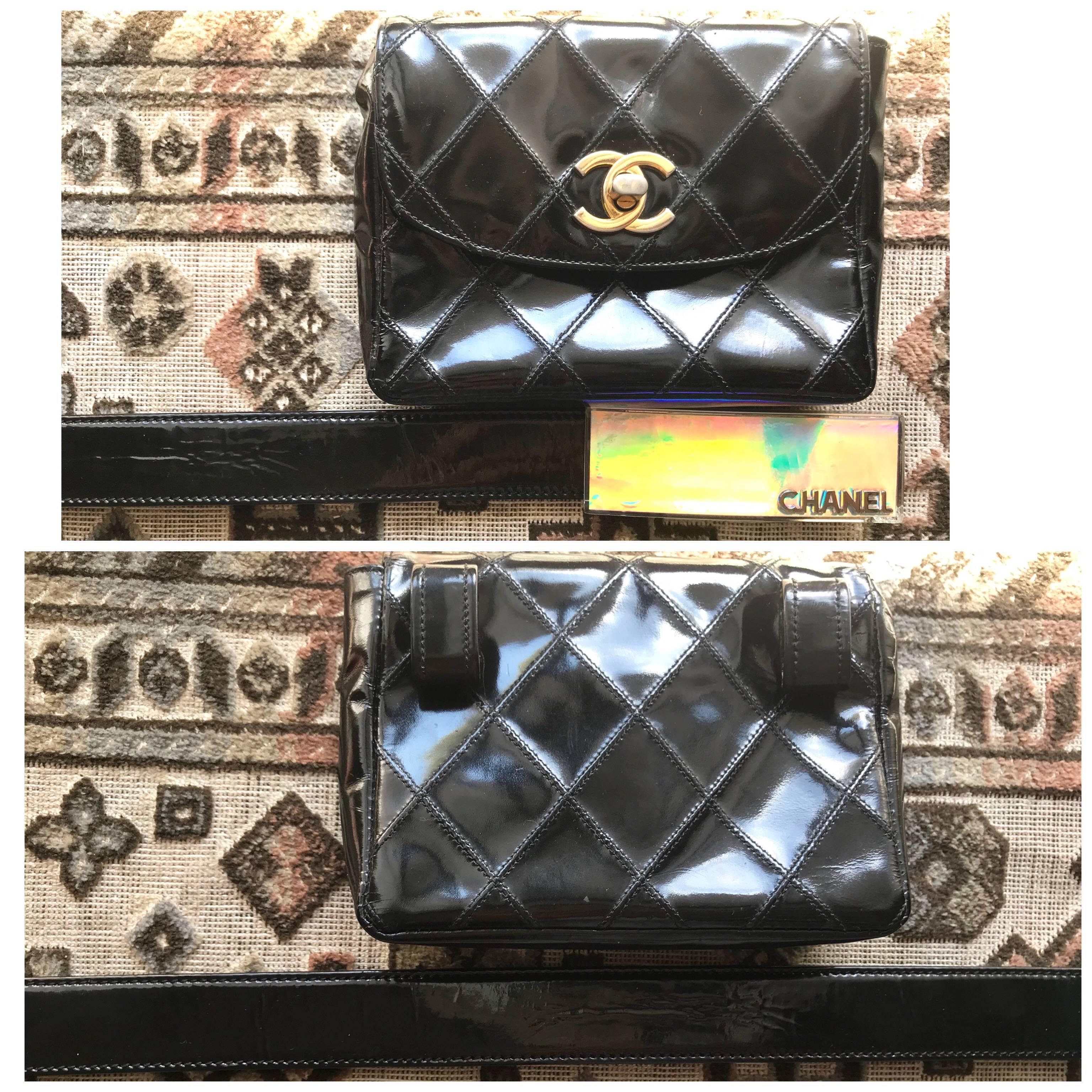 1990s. Vintage CHANEL black patent enamel pouch, fanny pack with golden CC motif. Comes with the rainbow shining aurora logo buckle belt.

*****Please note that the belt is not the original matching belt but another vintage CHANEL belt from