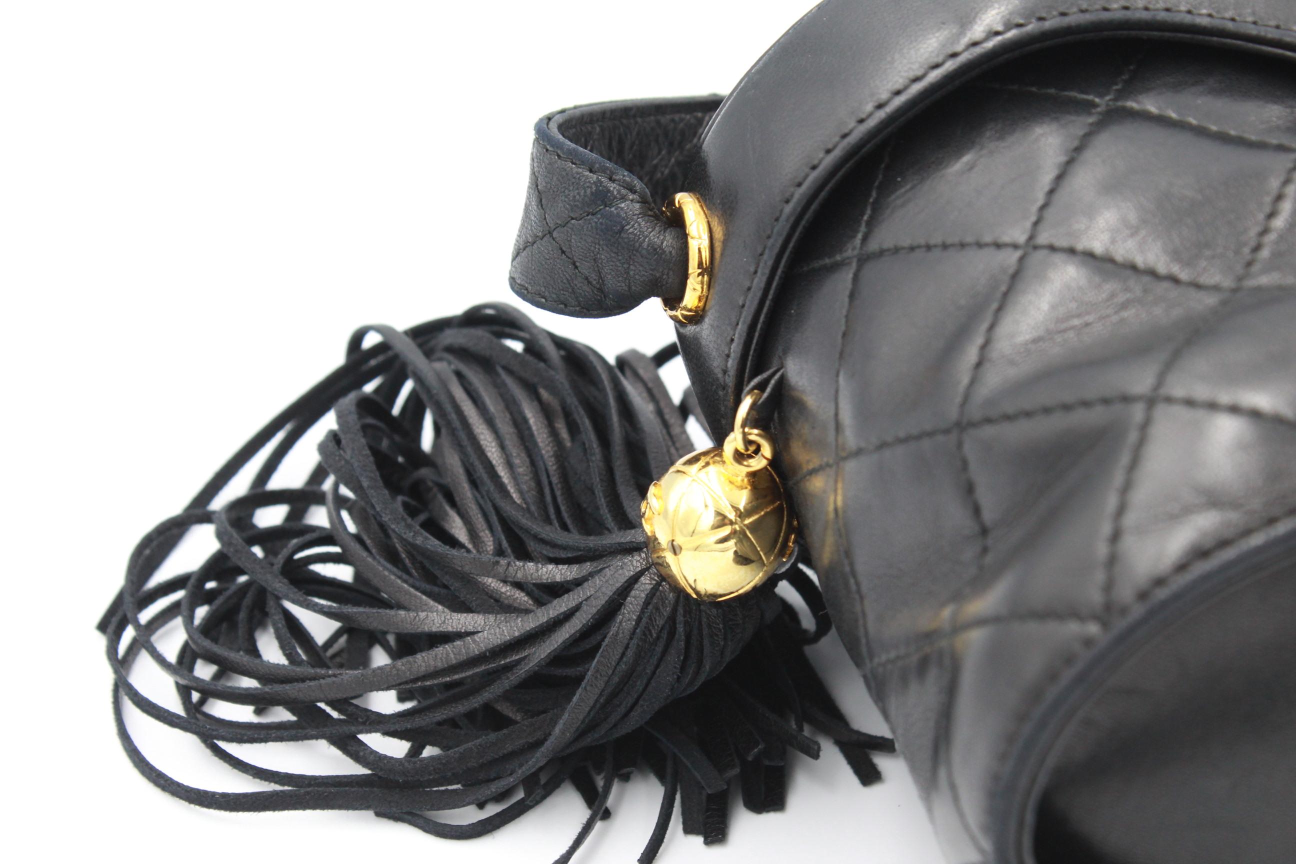 Women's or Men's Vintage Chanel Black Quilted Bag with Tassel and Mirror