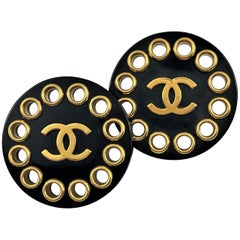 Vintage Chanel Black Resin With Gold Tone Rivets and CC Logo Earrings 1 5/8 inch