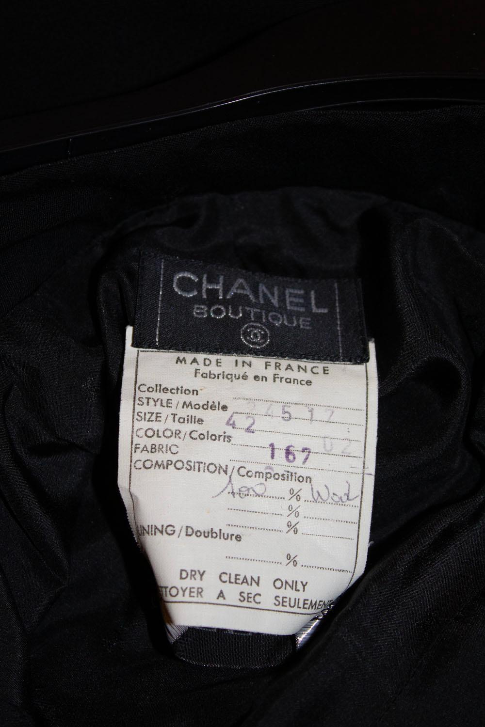A stunning pair of vintage Chanel tuxedo style pants.  The pants /trousers have a black satin ribbon running along the side , a two button waist fastening and zip fly. They are fully lined.
Size 42 , Measurements: waist 28/9'', inside leg 30''
Hem 3