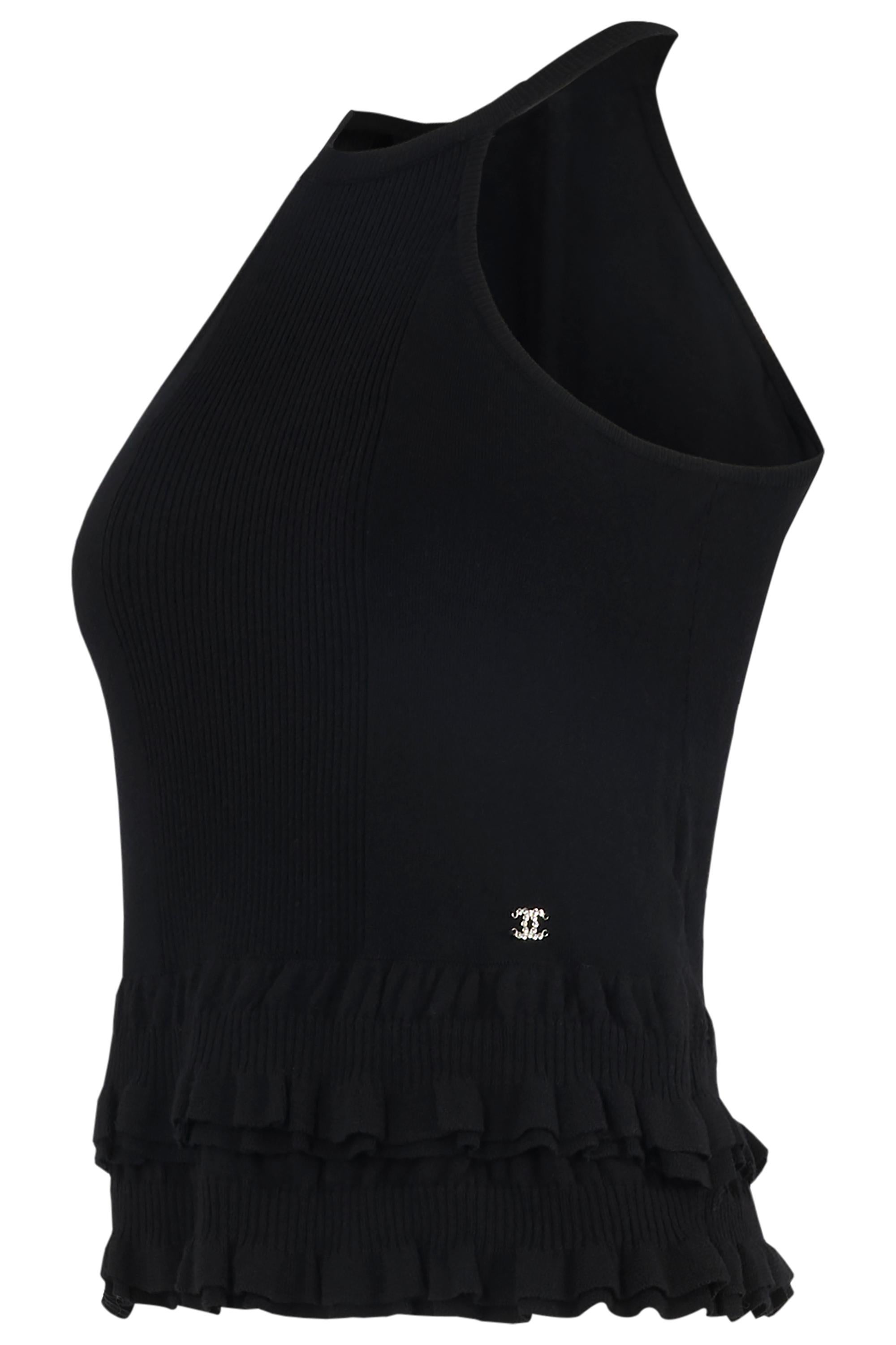 Vintage Chanel black wool ruffles tank top. Features of black wool body fabric , racerback style  and round neck. CC crystals logo on the left back side and ruffles at the hem. 

In excellent vintage condition. 

Brand: Chanel
Color: Black
Size: