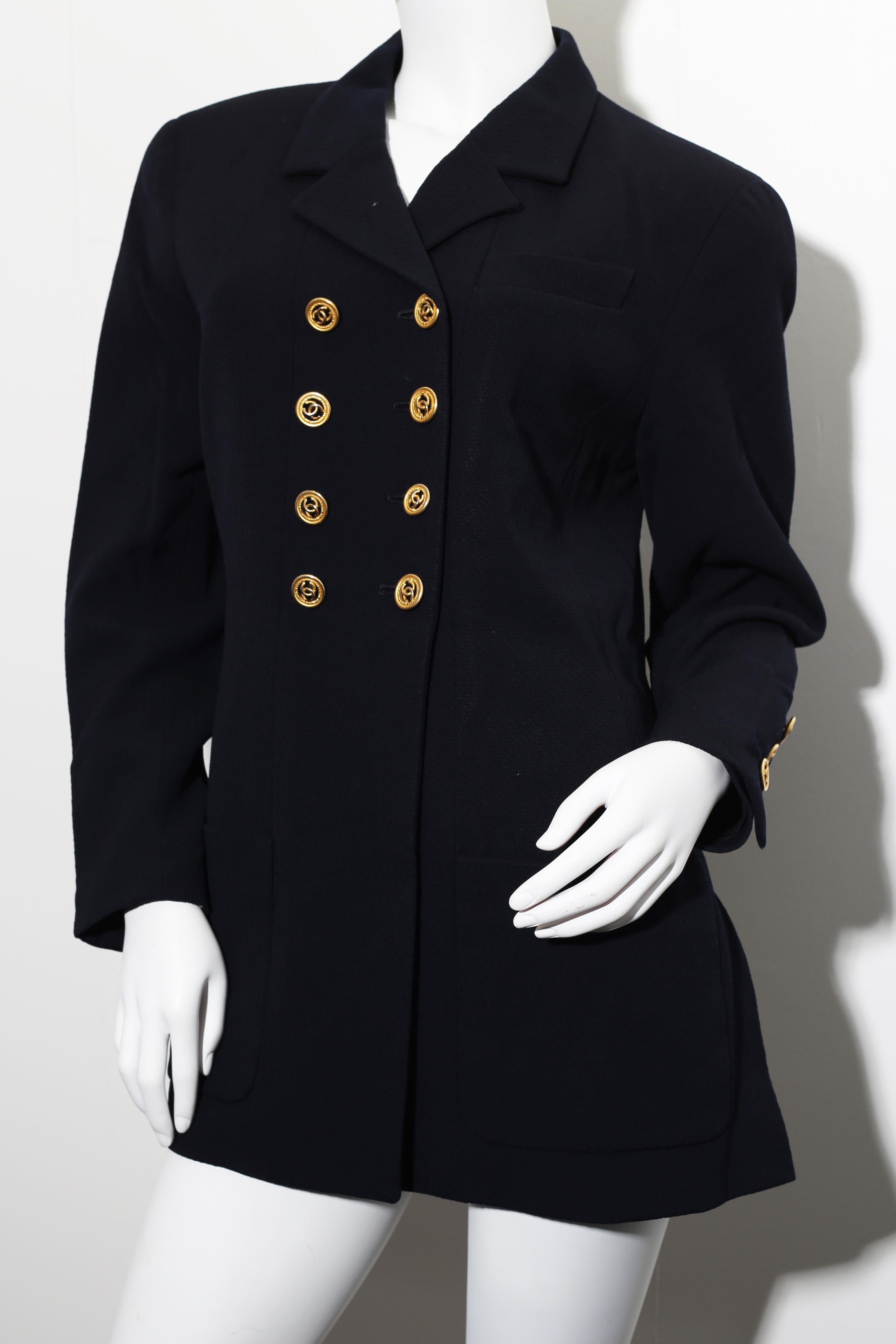 This is a timeless vintage Chanel  navy blue jacket  is 100% Wool with 100% Silk CC branded lining in the jacket. The jacket has black ribbon trim detail and gold CC Chanel buttons 8 in the front and 3 and 3 on the sleeves. The jacket has 2 lower