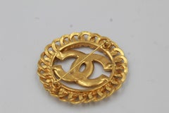 Vintage Chanel broche, double « C » in Gold metal.