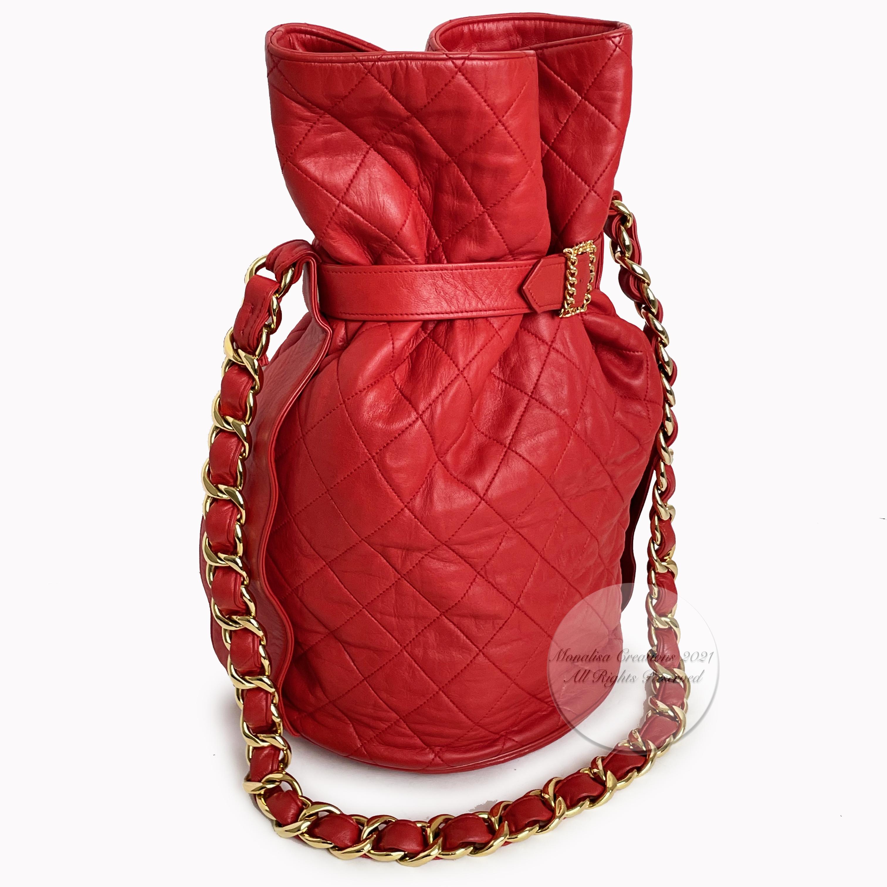 Authentic, preowned, vintage Chanel Buckle Bag with chain strap in red matelasse leather, circa the 90s.  Incredibly rare bag in an equally hard to find color.  If you search old videos of the Chanel Fall/Winter '92 RTW collection, you'll see this