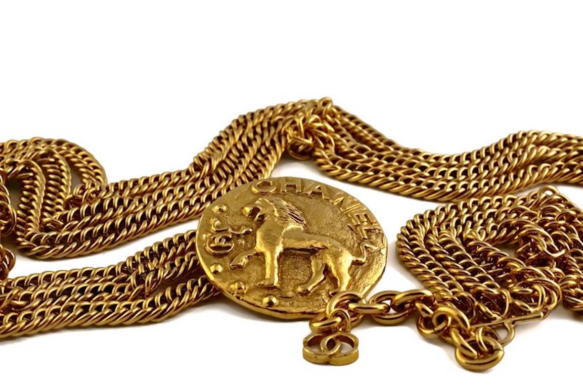 Vintage CHANEL by Robert Goossens Lion Medallion Triple Chain Necklace Belt

Measurements:
Medallion: 2 inches X 2 inches
Wearable Length: 31 inches to 33 inches

Features:
- 100% Authentic CHANEL by Robert Goossens.
- Triple chain necklace/ belt.