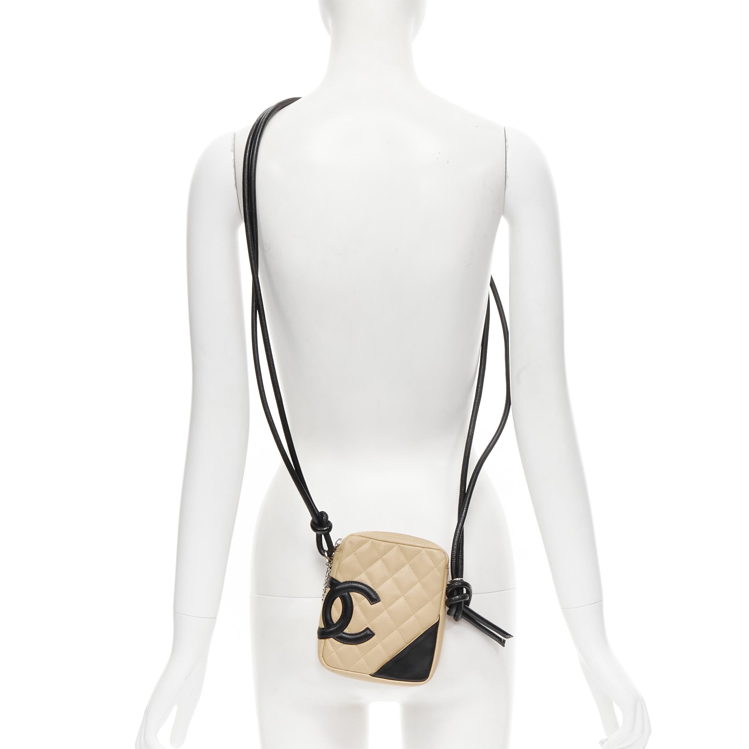 vintage CHANEL Cambon nude black diamond quilted CC logo crossbody bag 
Reference: CNLE/A00138 
Brand: Chanel 
Designer: Karl Lagerfeld 
Model: Cambon CC crossbody 
Material: Leather 
Color: Beige 
Pattern: Solid 
Closure: Zip 
Extra Detail: Knotted