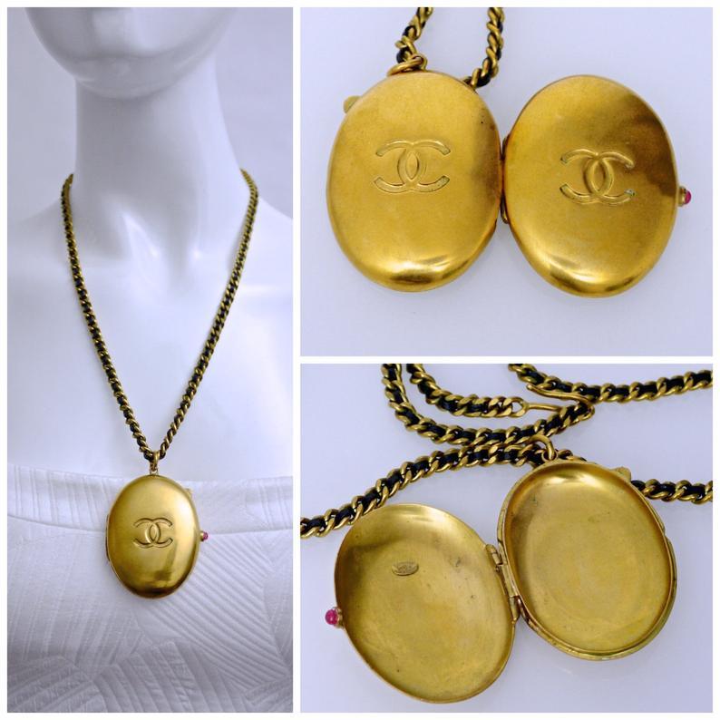 This Vintage CHANEL CC Locket Leather Chain Necklace is very RARE. A must have for collectors!

Features:
- 100% Authentic CHANEL.
- Locket pendant with engraved CC logo at the front and back.
- Chain and leather necklace.
- Gripoix/ poured glass