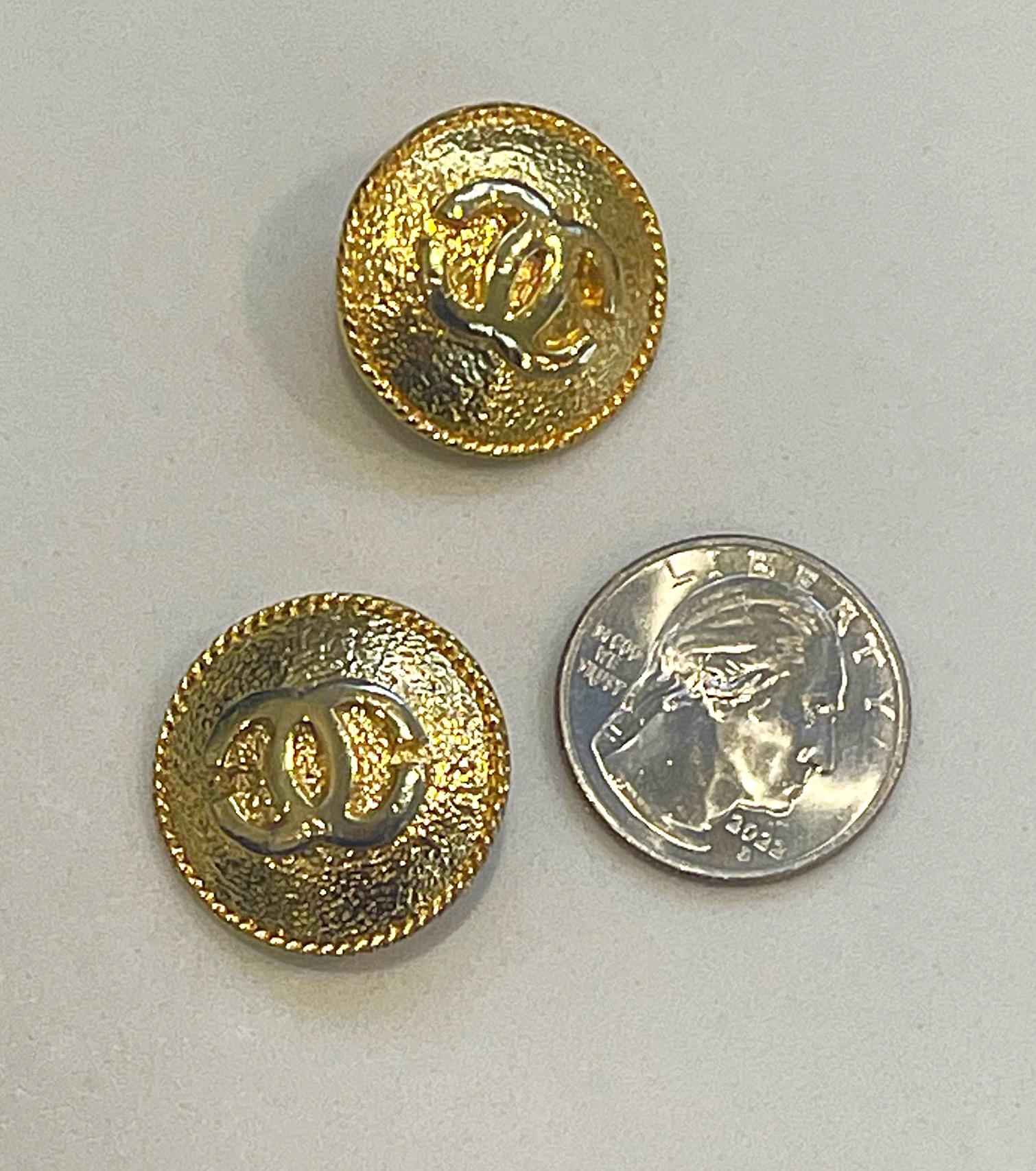 Pair of two vintage CHANEL gold tone CC logo embossed buttons. Can be used as buttons, or can easily be turned into earrings or a brooch.
In great condition 
Measures 1 inch by 1 inch