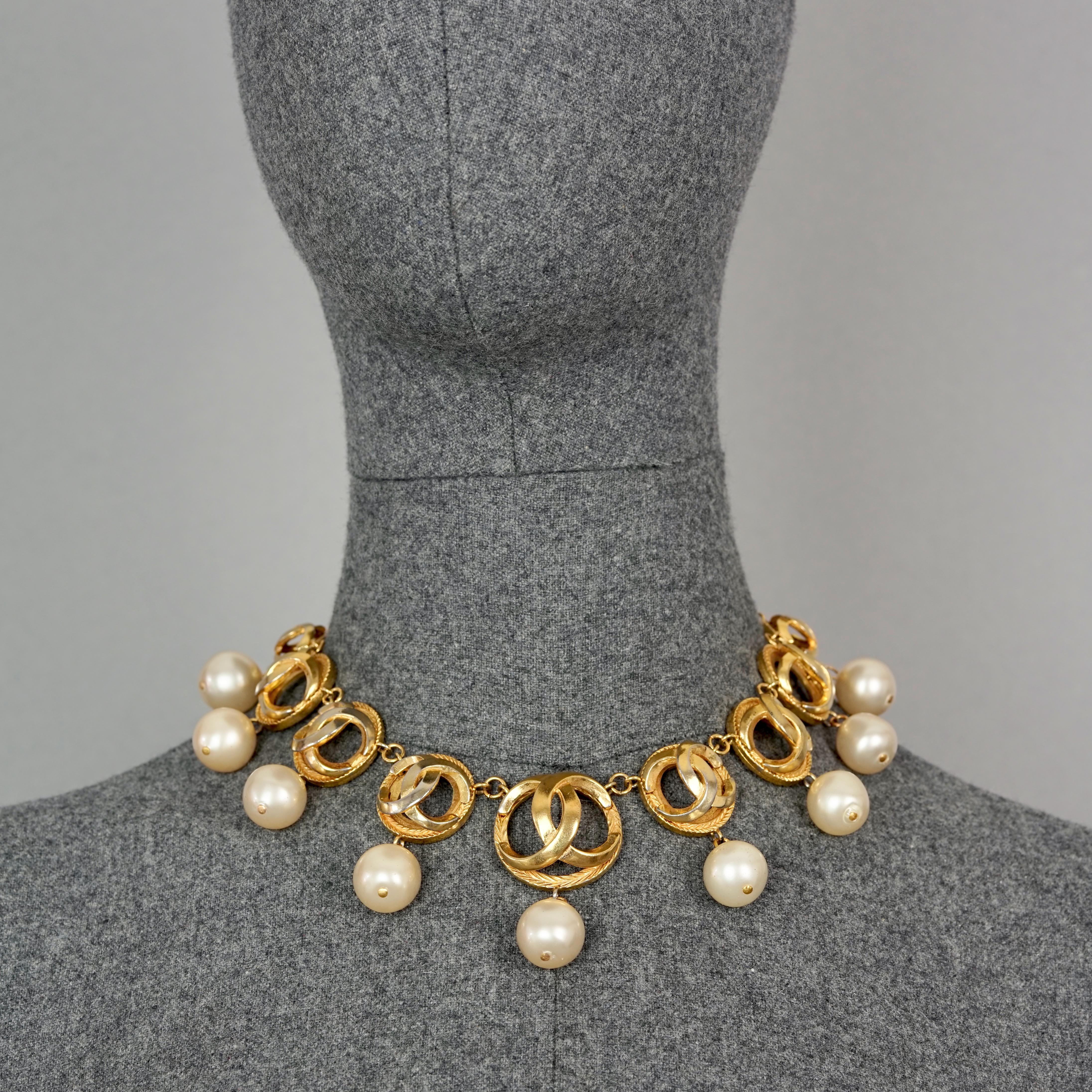 Vintage CHANEL CC Logo Links Pearl Charms Necklace

Measurements:
Height: 2.16 inches  (5.5 cm)
Wearable Length: 14.76 inches (37.5 cm)

Features: 
- 100% Authentic CHANEL.
- Iconic CHANEL CC logo links with glass pearl charms.
- Signed CHANEL CC