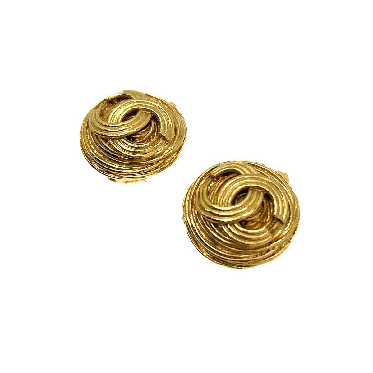A Pair of Vintage Chanel CC Nest Earrings. Centring on the iconic mid century design by Coco Chanel. Adorned in true 90s Lagerfeld style with the iconic interlocking CC logo. The quintessential piece of Chanel jewellery that will prove a timeless