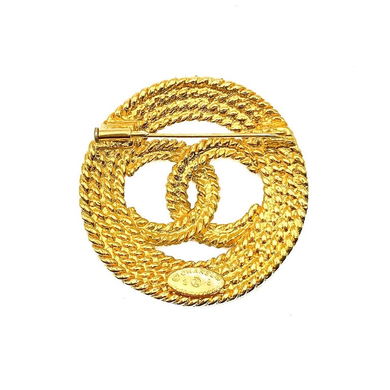 A stunning Vintage Chanel CC Rope Brooch dating to the 1980s and during the early years of Karl Lagerfeld and Victoire de Castellane at the head of costume jewels for Chanel. Featuring the iconic interlocking CC Logo of Coco Chanel in a rope twist